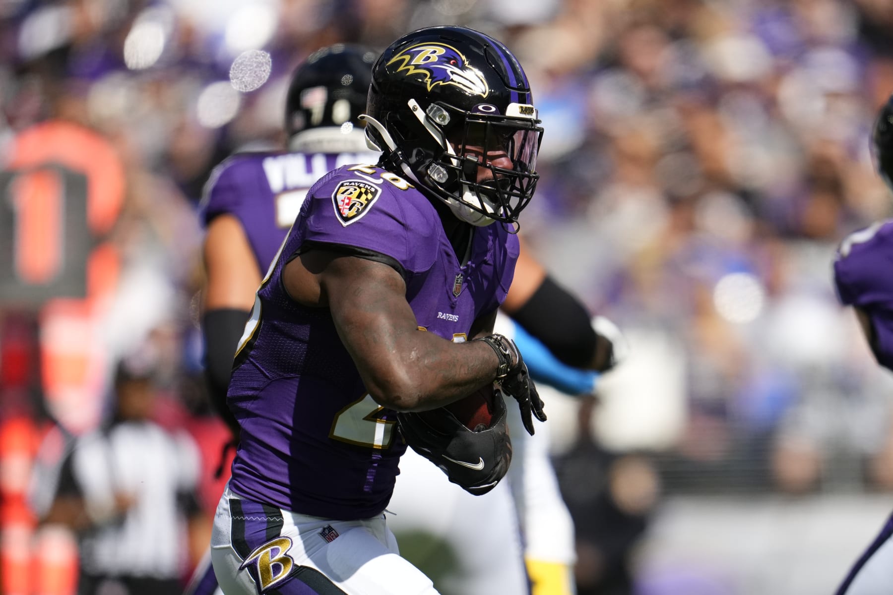 BALTIMORE, MARYLAND - OCTOBER 17: Latavius Murray #28 of the Baltimore Ravens runs the ball during to an NFL game against the Los Angeles Chargers at M&T Bank Stadium on October 17, 2021 in Baltimore, Maryland. (Photo by Cooper Neill/Getty Images)