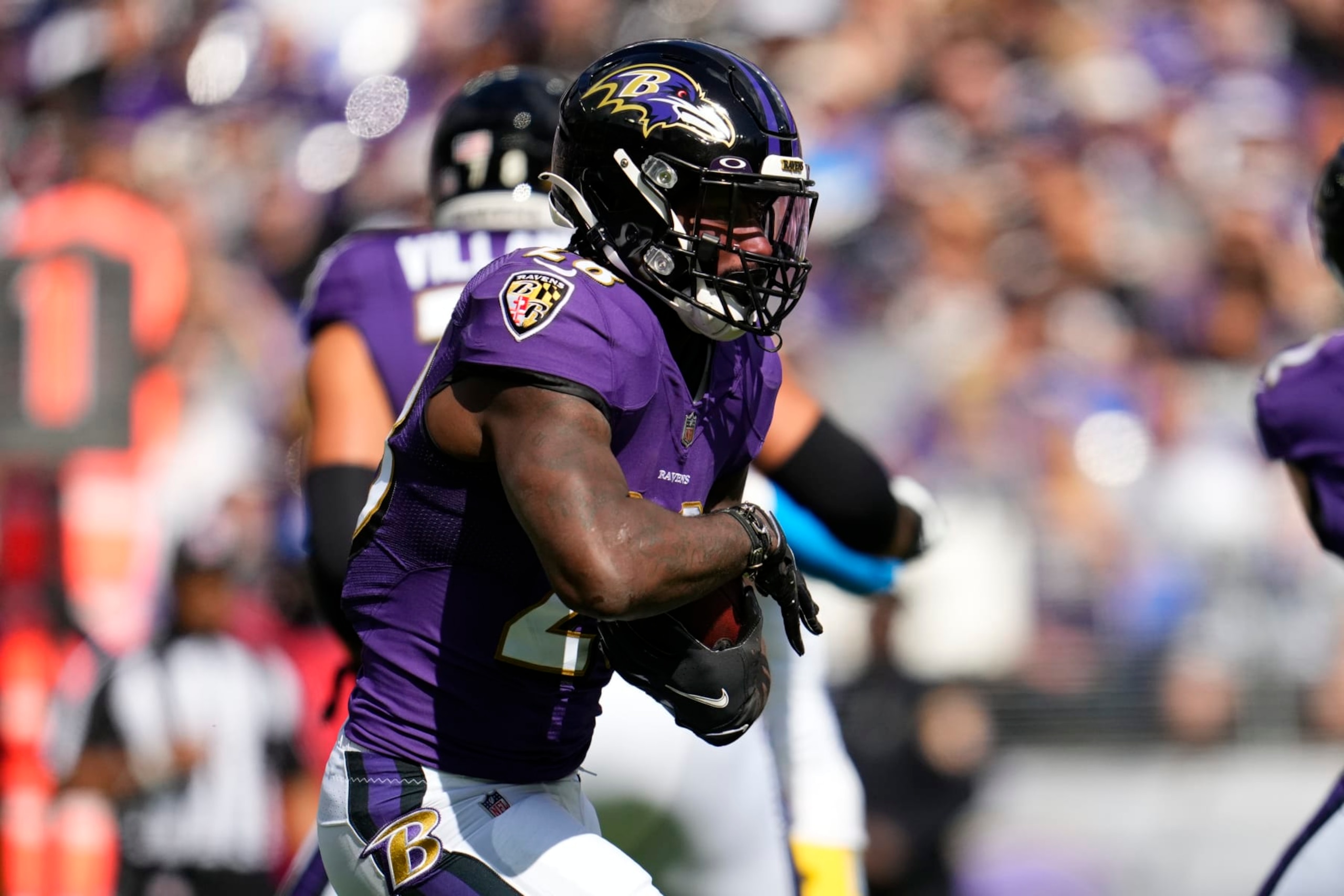 BALTIMORE, MARYLAND - OCTOBER 17: Latavius Murray #28 of the Baltimore Ravens runs the ball during to an NFL game against the Los Angeles Chargers at M&T Bank Stadium on October 17, 2021 in Baltimore, Maryland. (Photo by Cooper Neill/Getty Images)