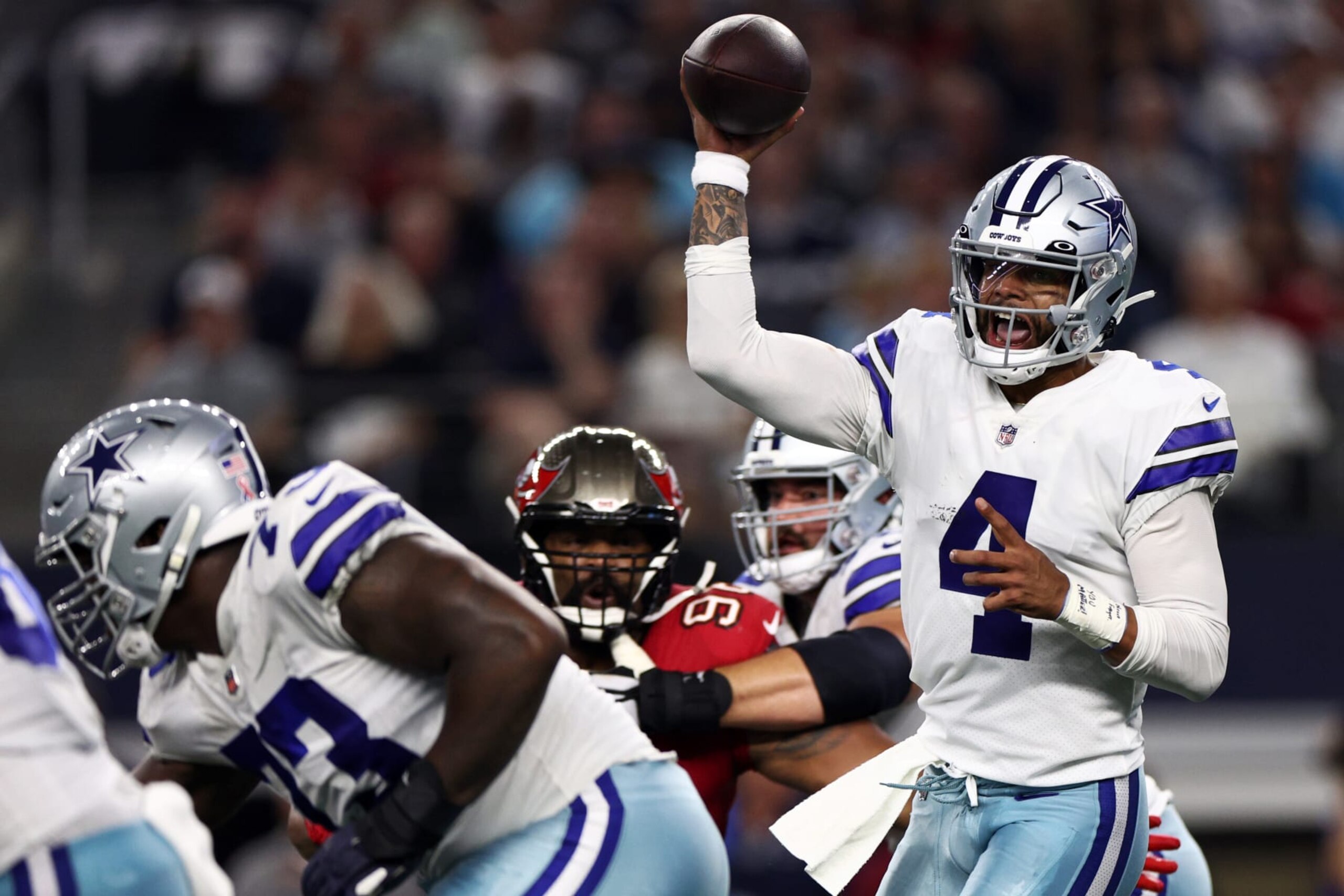 ARLINGTON, TEXAS - SEPTEMBER 11: Dak Prescott #4 of the Dallas Cowboys makes a pass against the Tampa Bay Buccaneers during the first half at AT&T Stadium on September 11, 2022 in Arlington, Texas. (Photo by Tom Pennington/Getty Images)