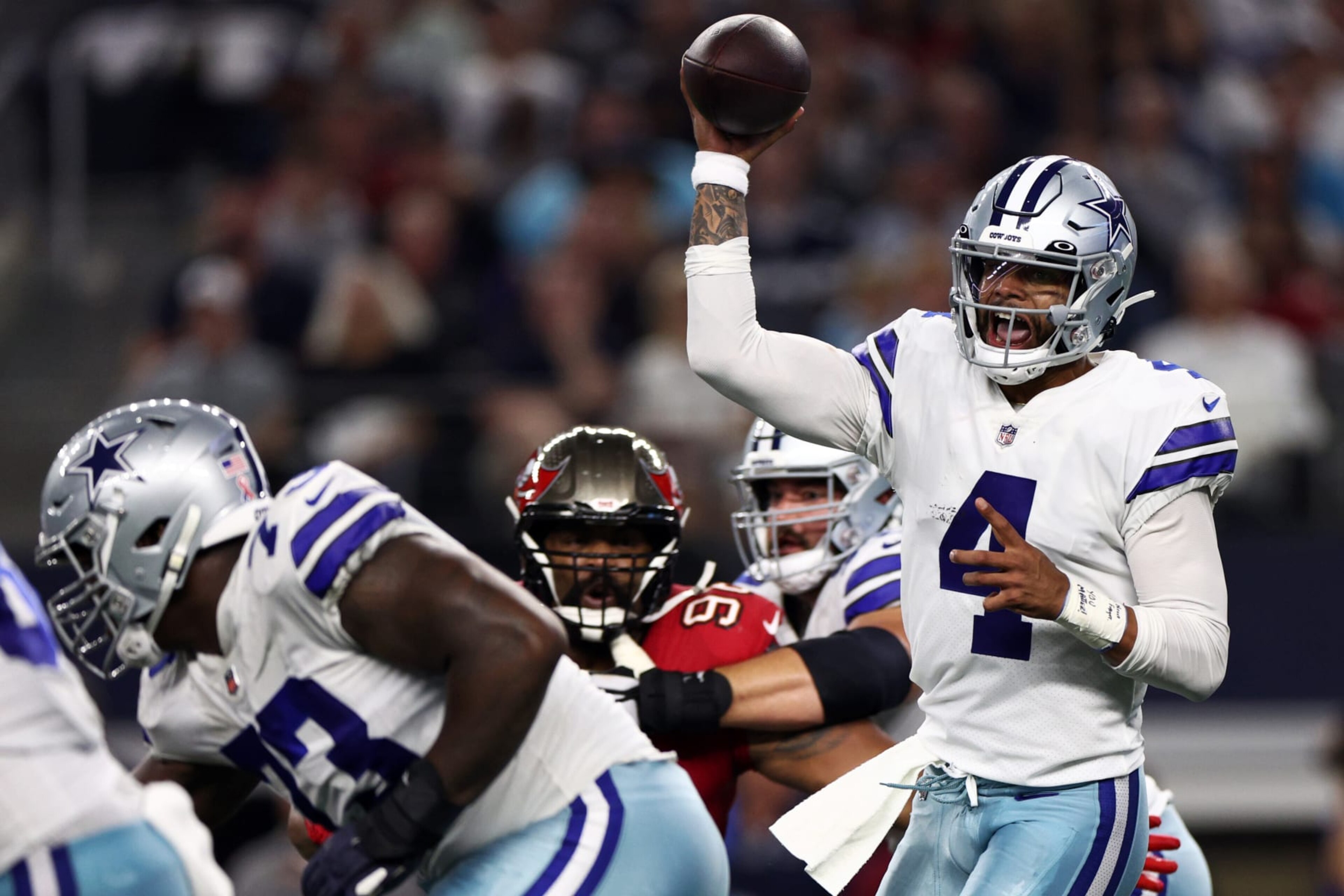 ARLINGTON, TEXAS - SEPTEMBER 11: Dak Prescott #4 of the Dallas Cowboys makes a pass against the Tampa Bay Buccaneers during the first half at AT&T Stadium on September 11, 2022 in Arlington, Texas. (Photo by Tom Pennington/Getty Images)