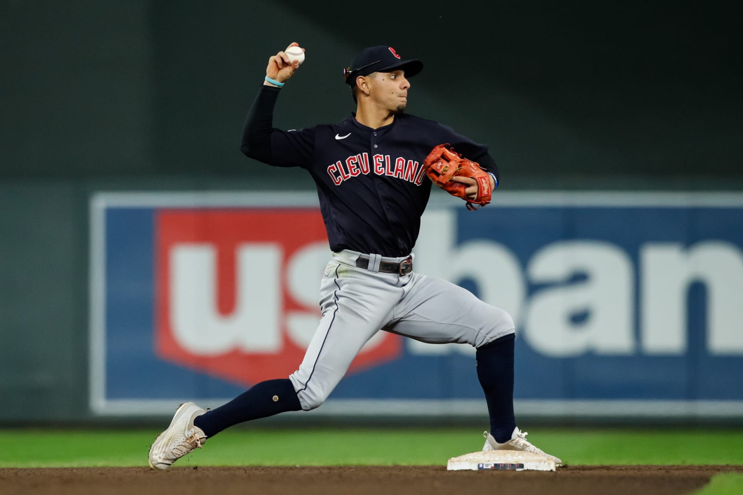 MINNEAPOLIS, MN - SEPTEMBER 10: Andres Gimenez #0 of the Cleveland Guardians turns a double play against the Minnesota Twins in the fifth inning of the game at Target Field on September 10, 2022 in Minneapolis, Minnesota. The Guardians defeated the Twins 6-4. (Photo by David Berding/Getty Images)