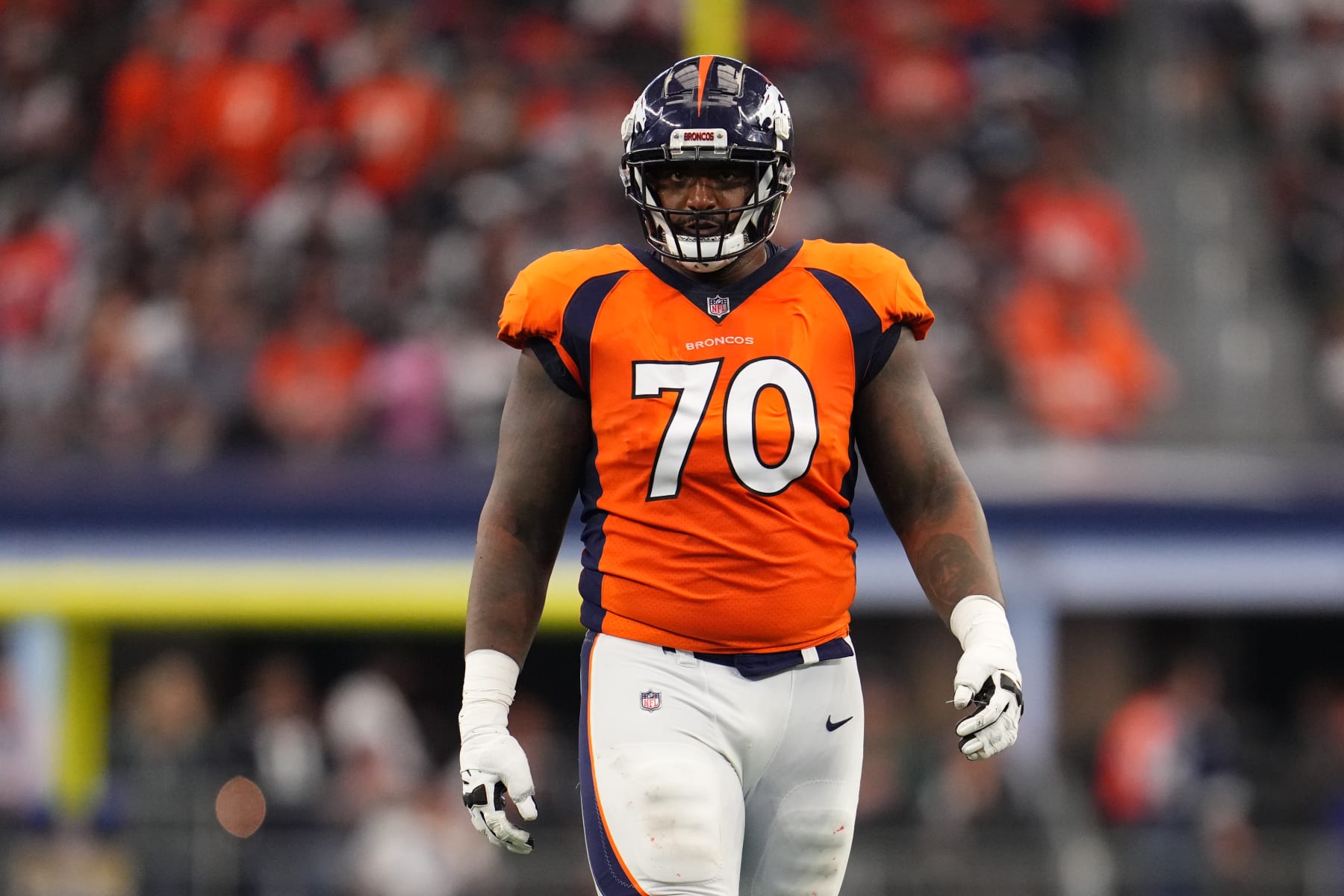 ARLINGTON, TEXAS - NOVEMBER 07: Bobby Massie #70 of the Denver Broncos gets set against the Dallas Cowboys during an NFL game at AT&T Stadium on November 07, 2021 in Arlington, Texas. (Photo by Cooper Neill/Getty Images)