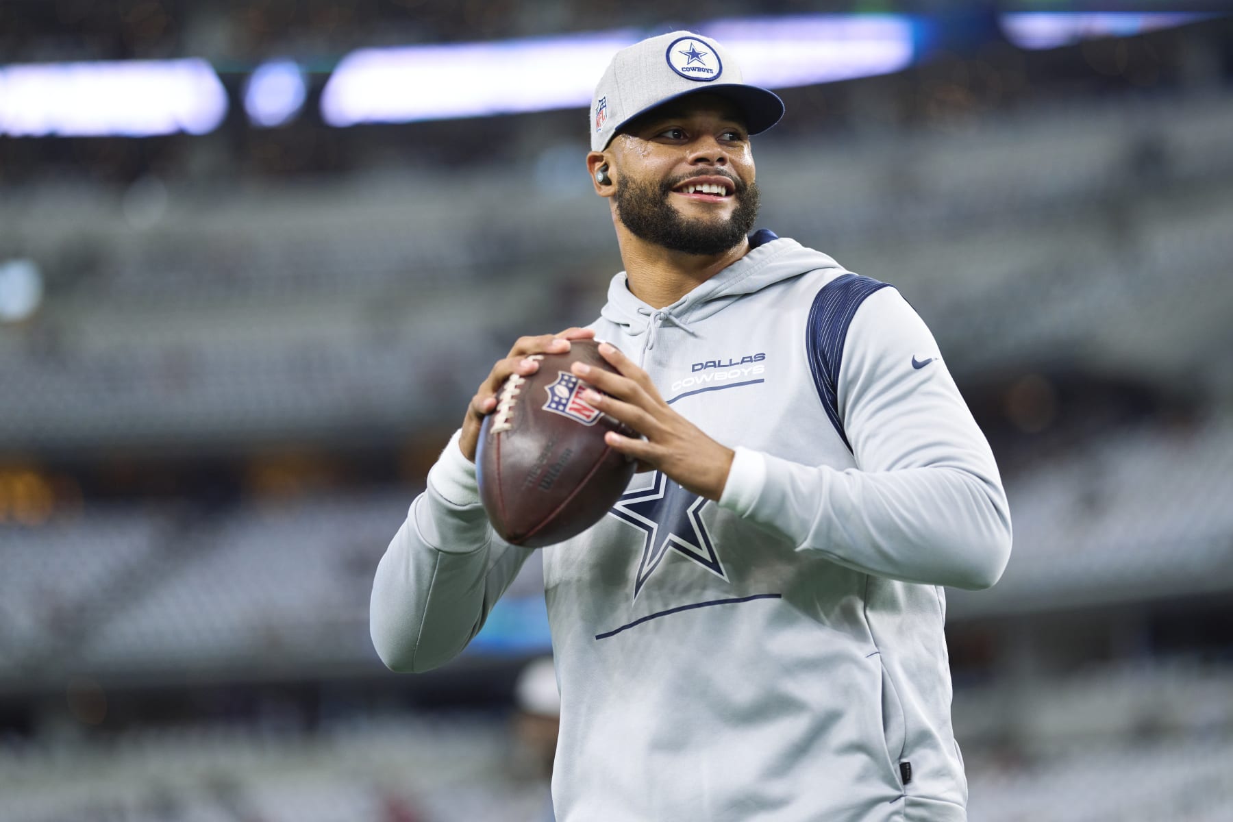 ARLINGTON, TX - SEPTEMBER 11: Dak Prescott #4 of the Dallas Cowboys warms up before kickoff against the Tampa Bay Buccaneers at AT&T Stadium on September 11, 2022 in Arlington, TX. (Photo by Cooper Neill/Getty Images)