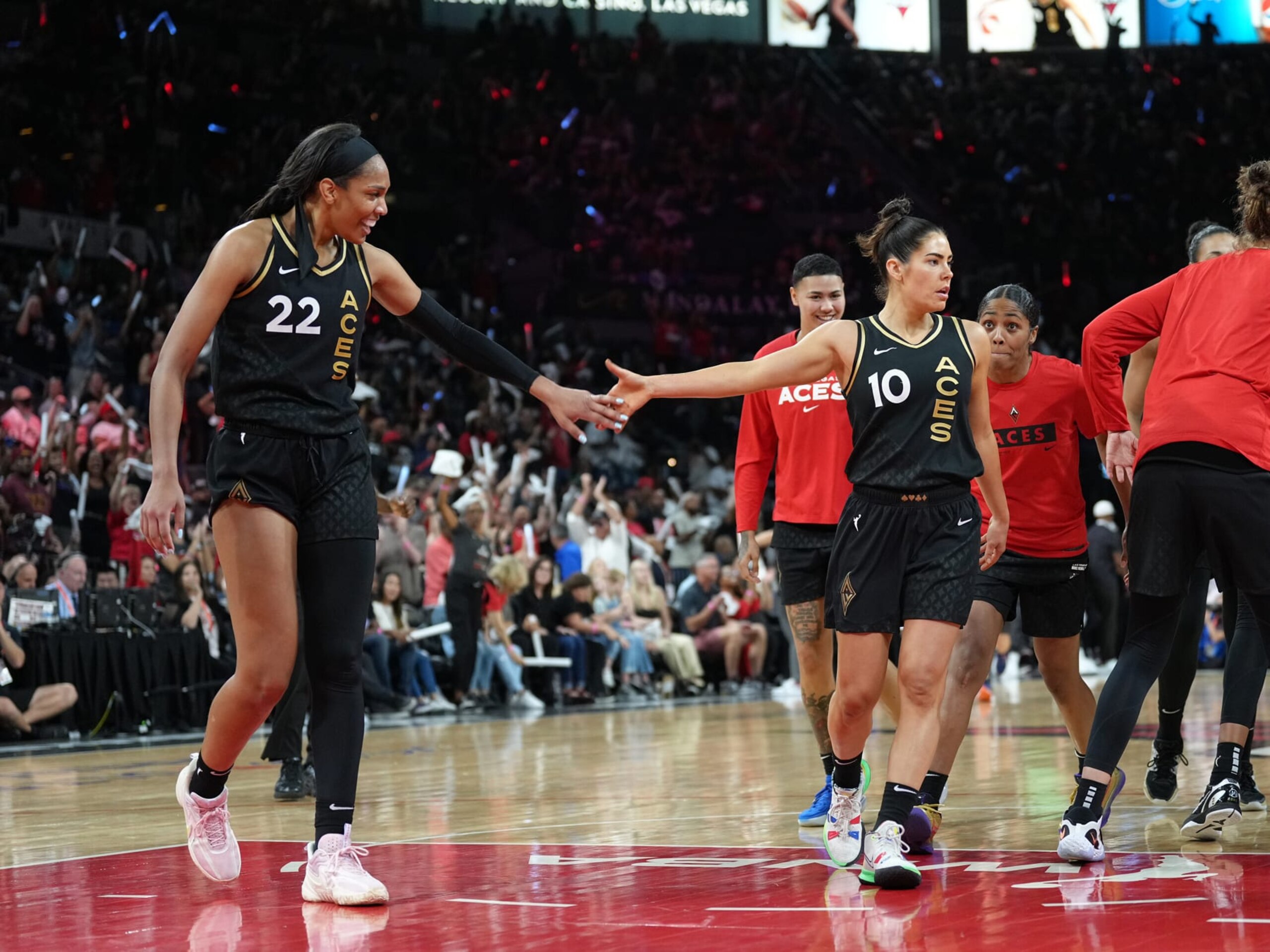 LAS VEGAS, NV - SEPTEMBER 11: Aja Wilson #22 high-fives Kelsey Plum #10 of the Las Vegas Aces during the game against the Connecticut Sun during Game 1 of the 2022 WNBA Finals on September 11, 2022 at Michelob ULTRA Arena in Las Vegas, Nevada. NOTE TO USER: User expressly acknowledges and agrees that, by downloading and or using this photograph, User is consenting to the terms and conditions of the Getty Images License Agreement. Mandatory Copyright Notice: Copyright 2022 NBAE (Photo by Jeff Bottari/NBAE via Getty Images)