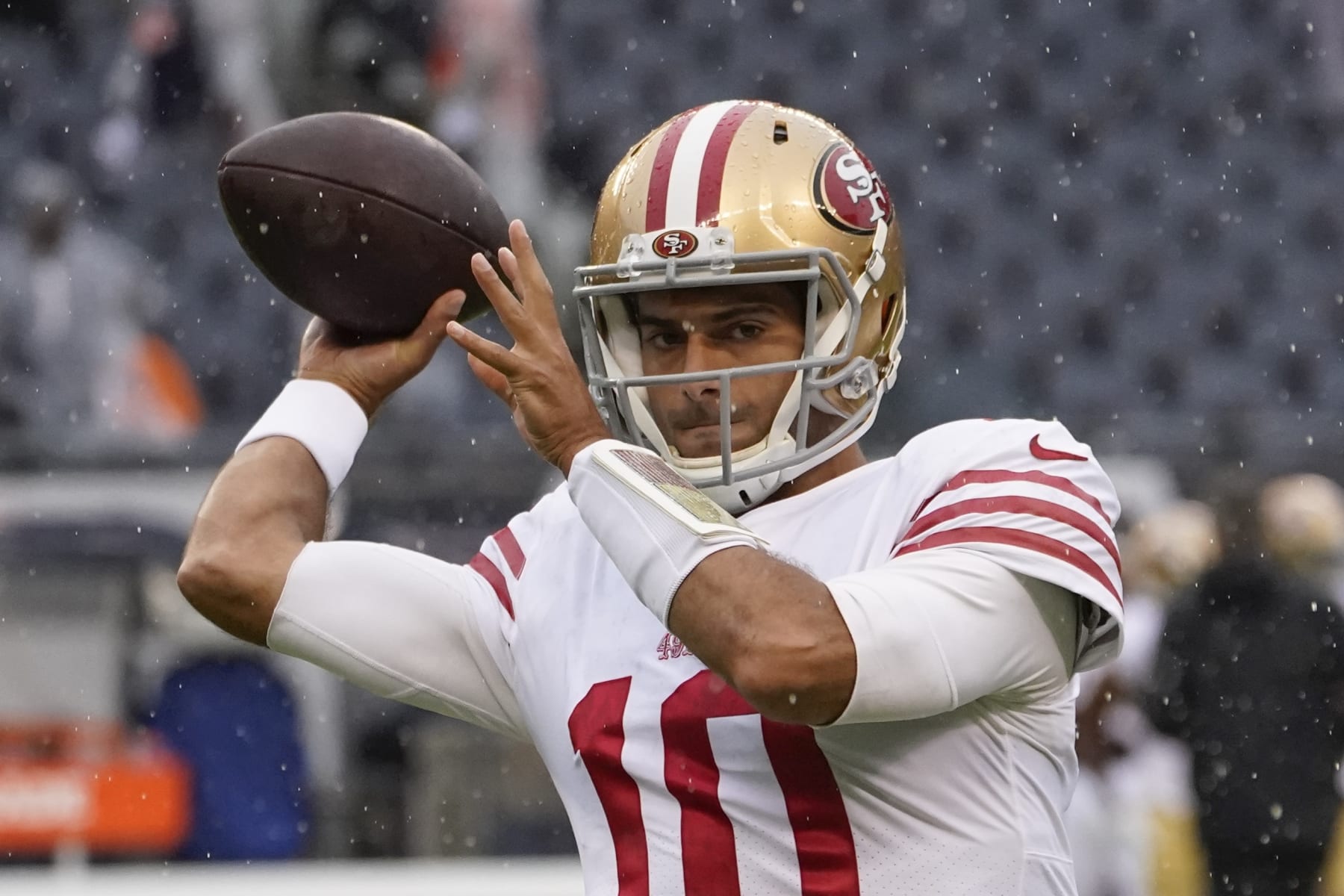 San Francisco 49ers' Jimmy Garoppolo warms up before an NFL football game against the Chicago Bears Sunday, Sept. 11, 2022, in Chicago. (AP Photo/Charles Rex Arbogast)