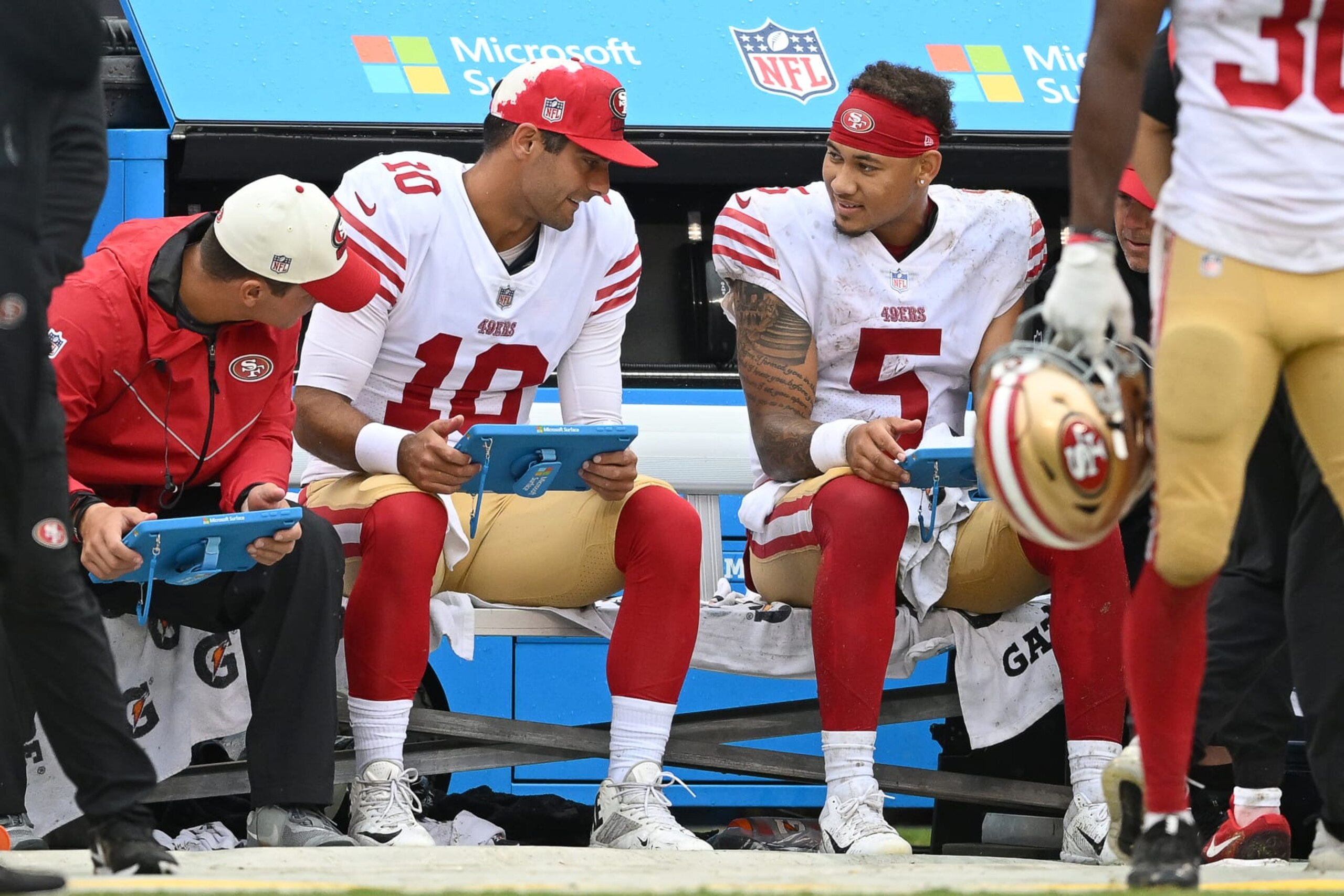 CHICAGO, IL - SEPTEMBER 11: San Francisco 49ers quarterbacks Trey Lance (5) and Jimmy Garoppolo (10) chat during a game between the San Francisco 49ers and the Chicago Bears on September 11, 2022 at Soldier Field in Chicago, IL. (Photo by Robin Alam/Icon Sportswire via Getty Images)