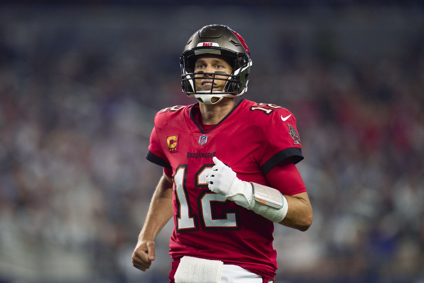 ARLINGTON, TX - SEPTEMBER 11: Tom Brady #12 of the Tampa Bay Buccaneers reacts after throwing a touchdown pass against the Dallas Cowboys at AT&T Stadium on September 11, 2022 in Arlington, TX. (Photo by Cooper Neill/Getty Images)