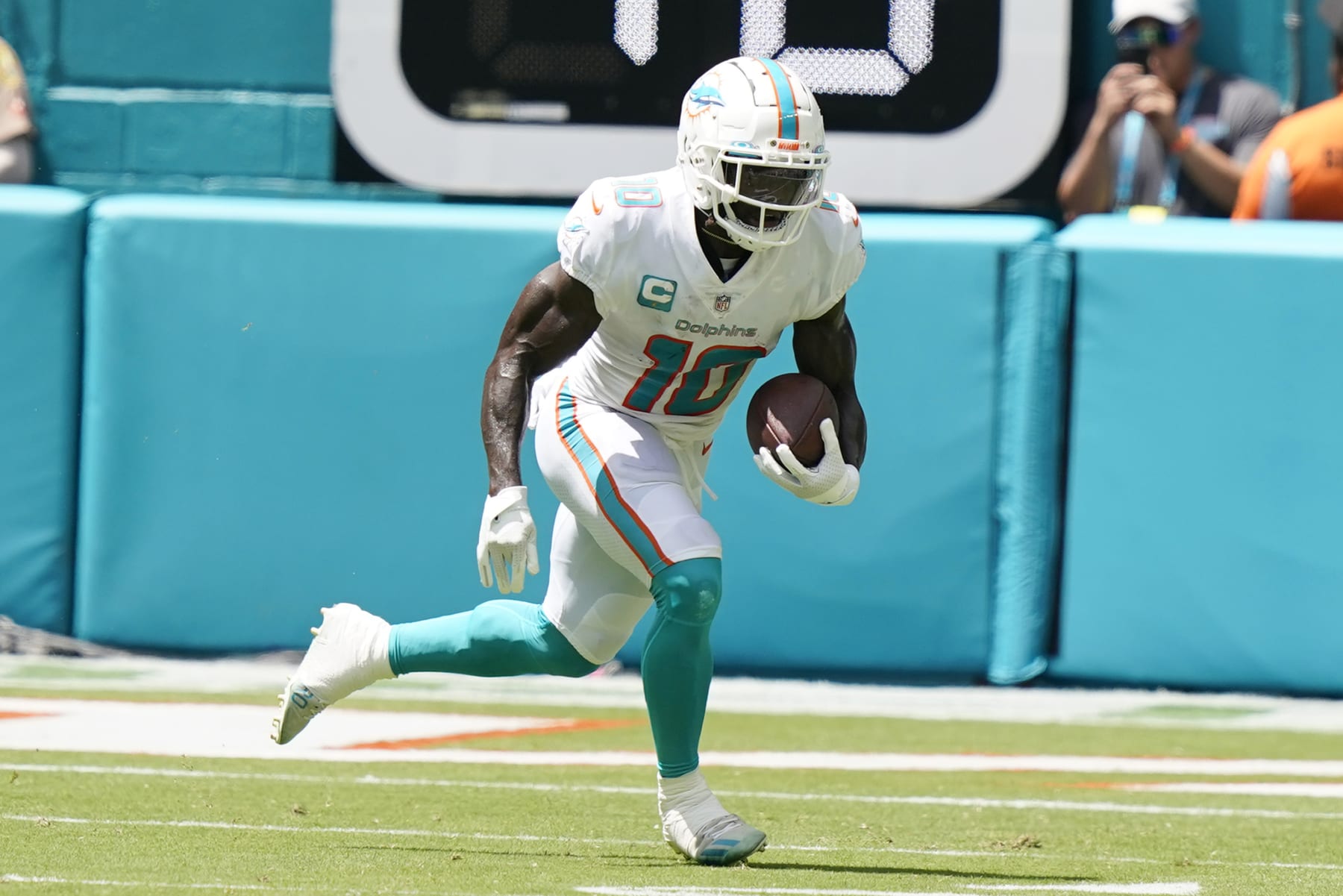 Miami Dolphins wide receiver Tyreek Hill (10) runs the ball during the first half of an NFL football game against the New England Patriots, Sunday, Sept. 11, 2022, in Miami Gardens, Fla. (AP Photo/Lynne Sladky)