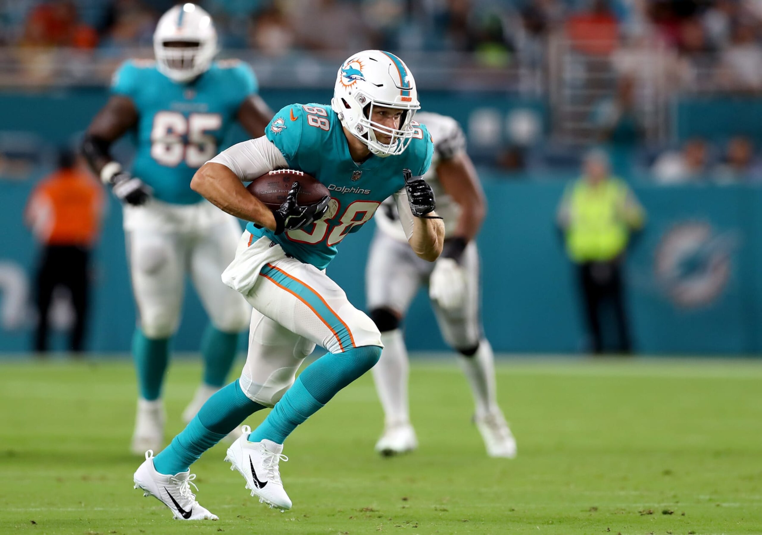 MIAMI GARDENS, FLORIDA - AUGUST 20: Mike Gesicki #88 of the Miami Dolphins carries the ball during the third quarter against the Las Vegas Raiders at Hard Rock Stadium on August 20, 2022 in Miami Gardens, Florida. (Photo by Megan Briggs/Getty Images)