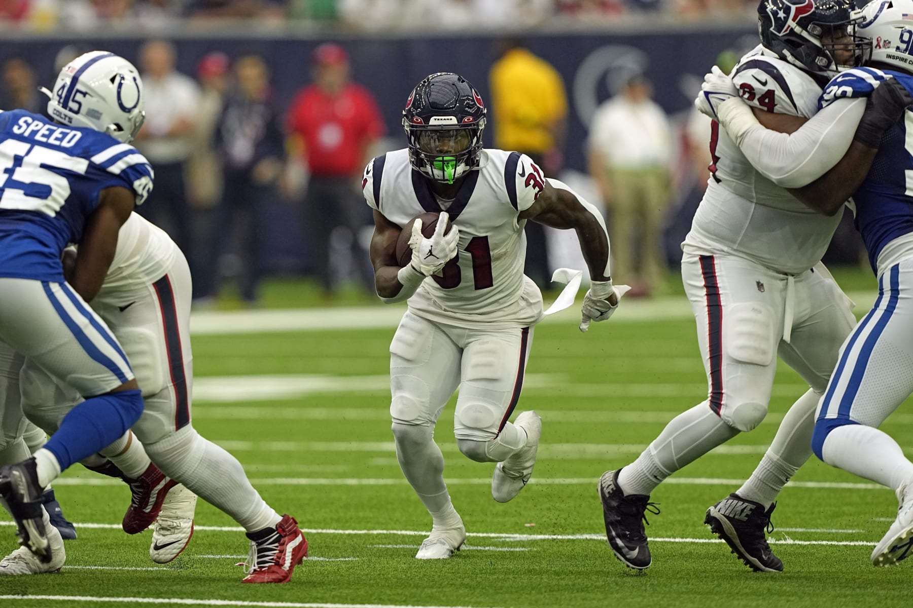 Houston Texans running back Dameon Pierce (31) rushes for a gain against the Indianapolis Colts during the second half of an NFL football game Sunday, Sept. 11, 2022, in Houston. (AP Photo/David J. Phillip)