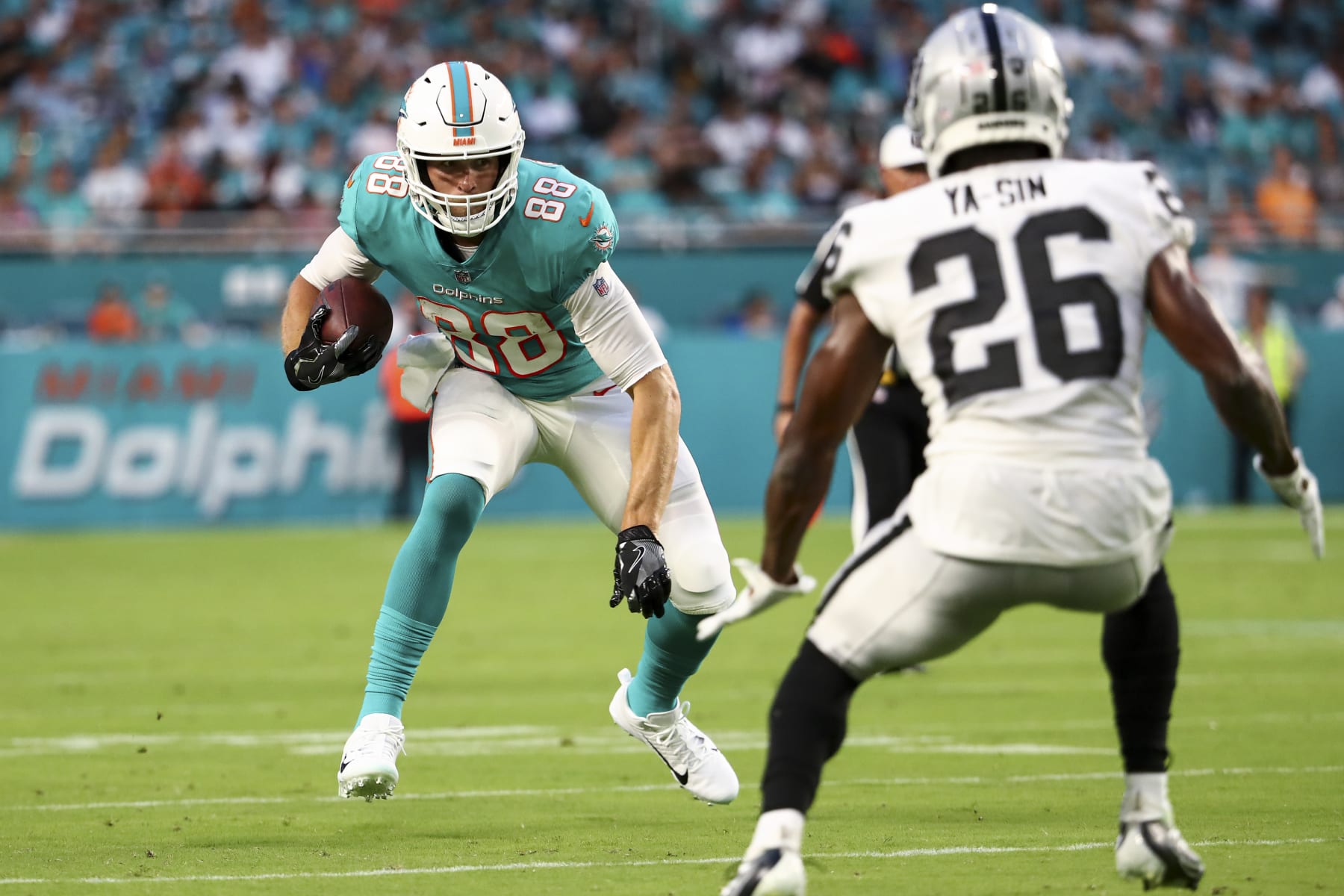 MIAMI GARDENS, FL - AUGUST 20: Mike Gesicki #88 of the Miami Dolphins carries the ball during a preseason NFL football game against the Las Vegas Raiders at Hard Rock Stadium on August 20, 2022 in Miami Gardens, Florida. (Photo by Kevin Sabitus/Getty Images)