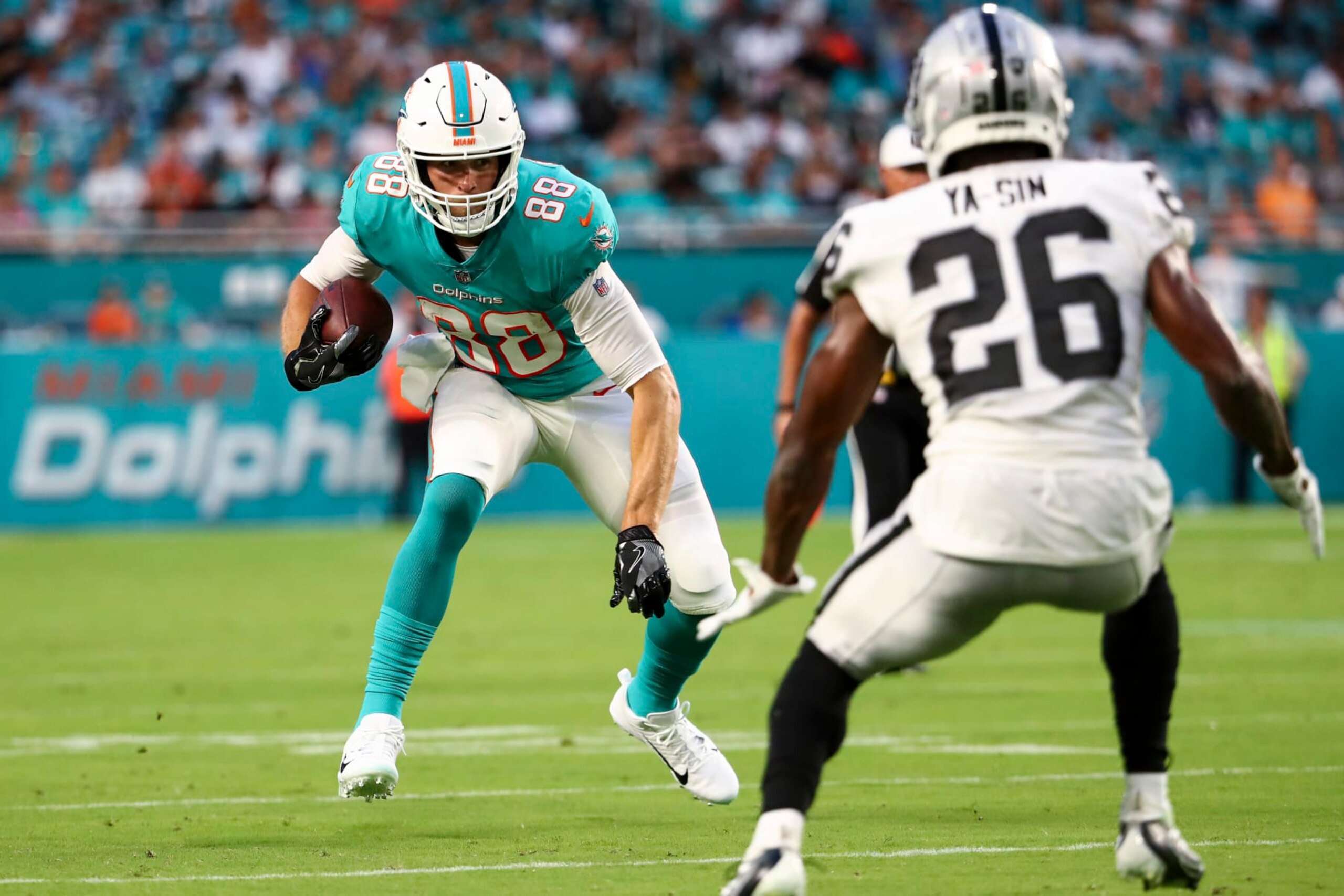 MIAMI GARDENS, FL - AUGUST 20: Mike Gesicki #88 of the Miami Dolphins carries the ball during a preseason NFL football game against the Las Vegas Raiders at Hard Rock Stadium on August 20, 2022 in Miami Gardens, Florida. (Photo by Kevin Sabitus/Getty Images)