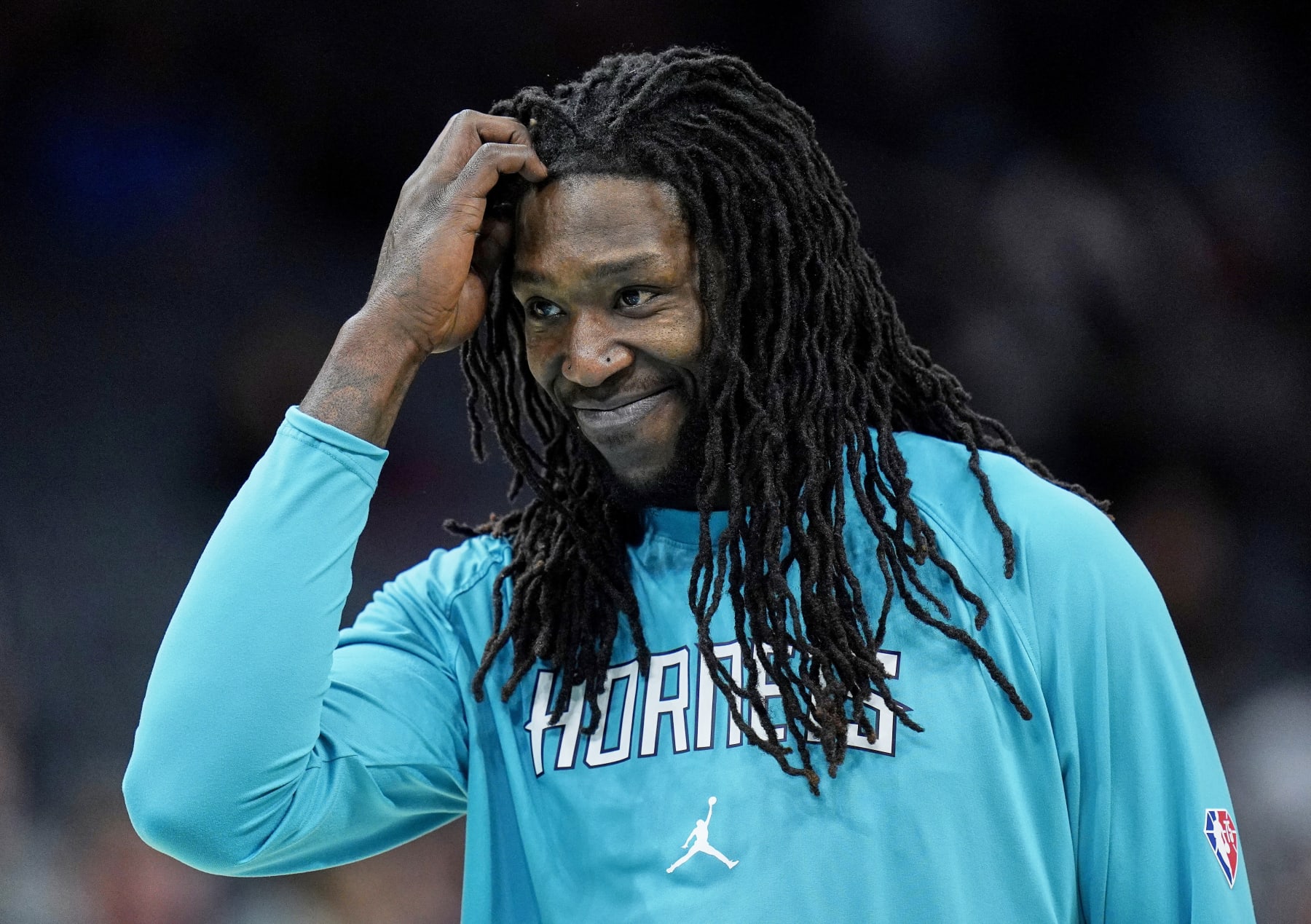 Charlotte Hornets center Montrezl Harrell smiles during warm ups at an NBA basketball game against the Washington Wizards on Sunday, April 10, 2022, in Charlotte, N.C. (AP Photo/Rusty Jones)