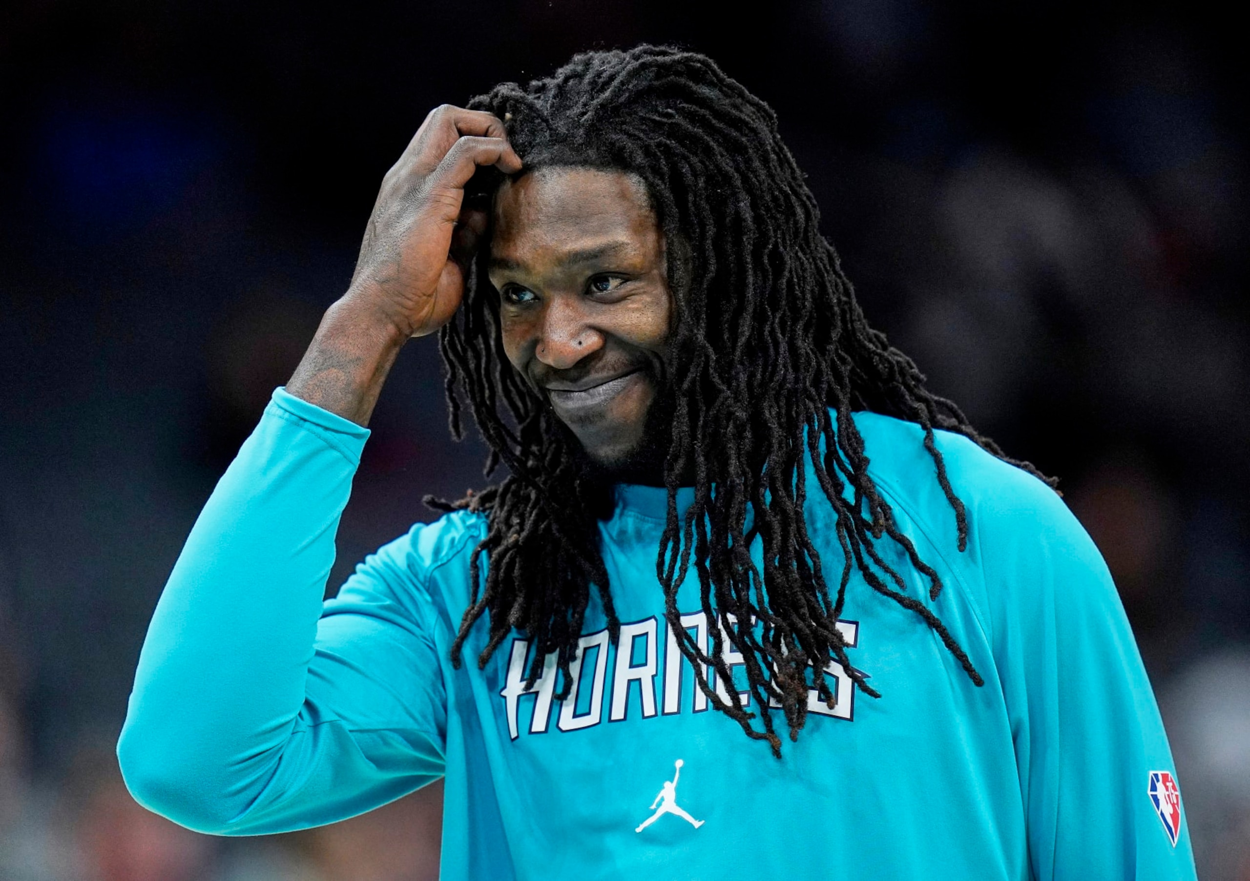 Charlotte Hornets center Montrezl Harrell smiles during warm ups at an NBA basketball game against the Washington Wizards on Sunday, April 10, 2022, in Charlotte, N.C. (AP Photo/Rusty Jones)