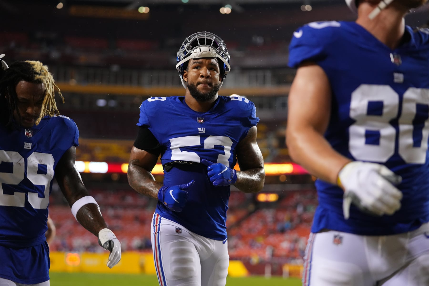LANDOVER, MARYLAND - SEPTEMBER 16: Oshane Ximines #53 of the New York Giants runs onto the field against the Washington Football Team prior to an NFL game at FedExField on September 16, 2021 in Landover, Maryland. (Photo by Cooper Neill/Getty Images)