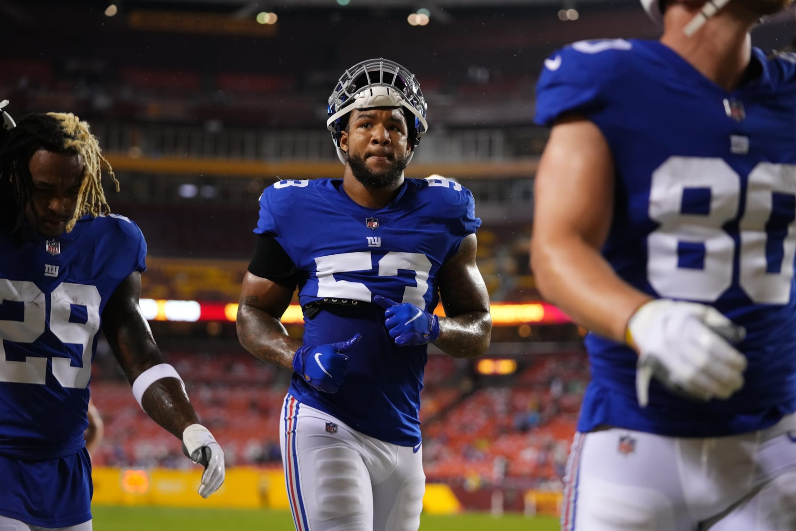 LANDOVER, MARYLAND - SEPTEMBER 16: Oshane Ximines #53 of the New York Giants runs onto the field against the Washington Football Team prior to an NFL game at FedExField on September 16, 2021 in Landover, Maryland. (Photo by Cooper Neill/Getty Images) LANDOVER, MARYLAND - SEPTEMBER 16: Oshane Ximines #53 of the New York Giants runs onto the field against the Washington Football Team prior to an NFL game at FedExField on September 16, 2021 in Landover, Maryland. (Photo by Cooper Neill/Getty Images)