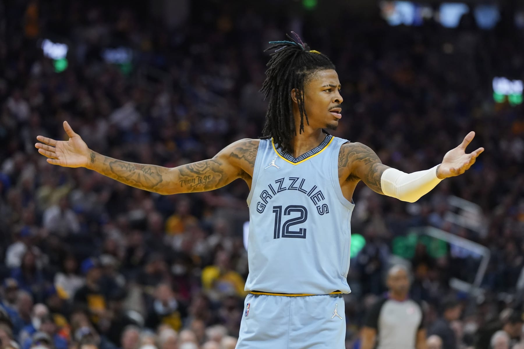 Memphis Grizzlies guard Ja Morant (12) reacts to an official's call during the second half of Game 3 of the team's NBA basketball Western Conference playoff semifinal against the Golden State Warriors in San Francisco, Saturday, May 7, 2022. (AP Photo/Jeff Chiu)