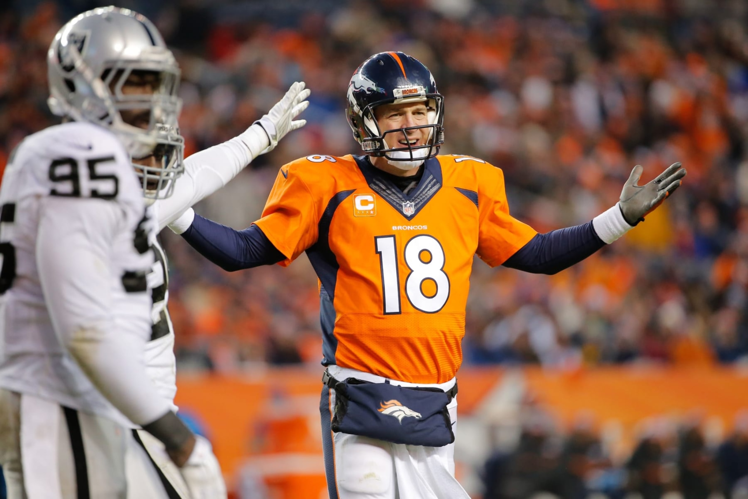 DENVER, CO - DECEMBER 28:  Quarterback Peyton Manning #18 of the Denver Broncos protests the spot of the football on a call that would be reviewed and changed to a first down ruling during a game against the Oakland Raiders at Sports Authority Field at Mile High on December 28, 2014 in Denver, Colorado.  (Photo by Doug Pensinger/Getty Images)