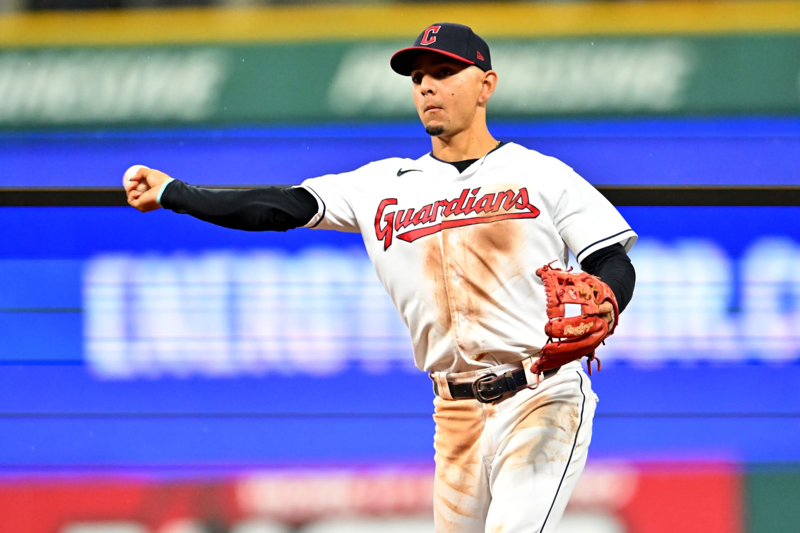 CLEVELAND, OHIO - AUGUST 20: Second baseman  Andres Gimenez #0 of the Cleveland Guardians throws out Gavin Sheets #32 of the Chicago White Sox at first to end the top of the sixth inning at Progressive Field on August 20, 2022 in Cleveland, Ohio. (Photo by Jason Miller/Getty Images)
