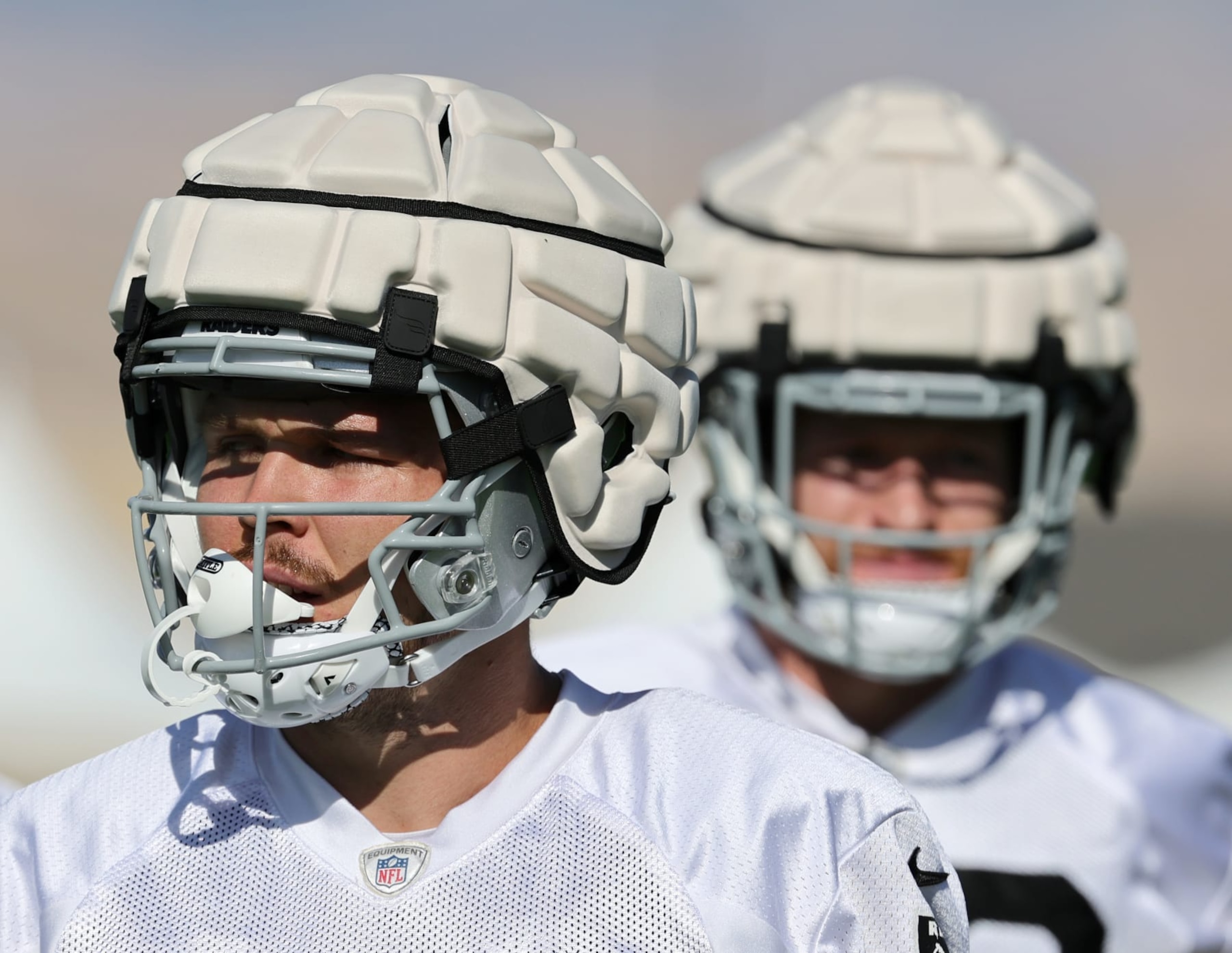 HENDERSON, NEVADA - AUGUST 01: Tight ends Jesper Horsted #80 and Nick Bowers #82 of the Las Vegas Raiders wear Guardian Caps as they practice during training camp at the Las Vegas Raiders Headquarters/Intermountain Healthcare Performance Center on August 01, 2022 in Henderson, Nevada. (Photo by Ethan Miller/Getty Images)