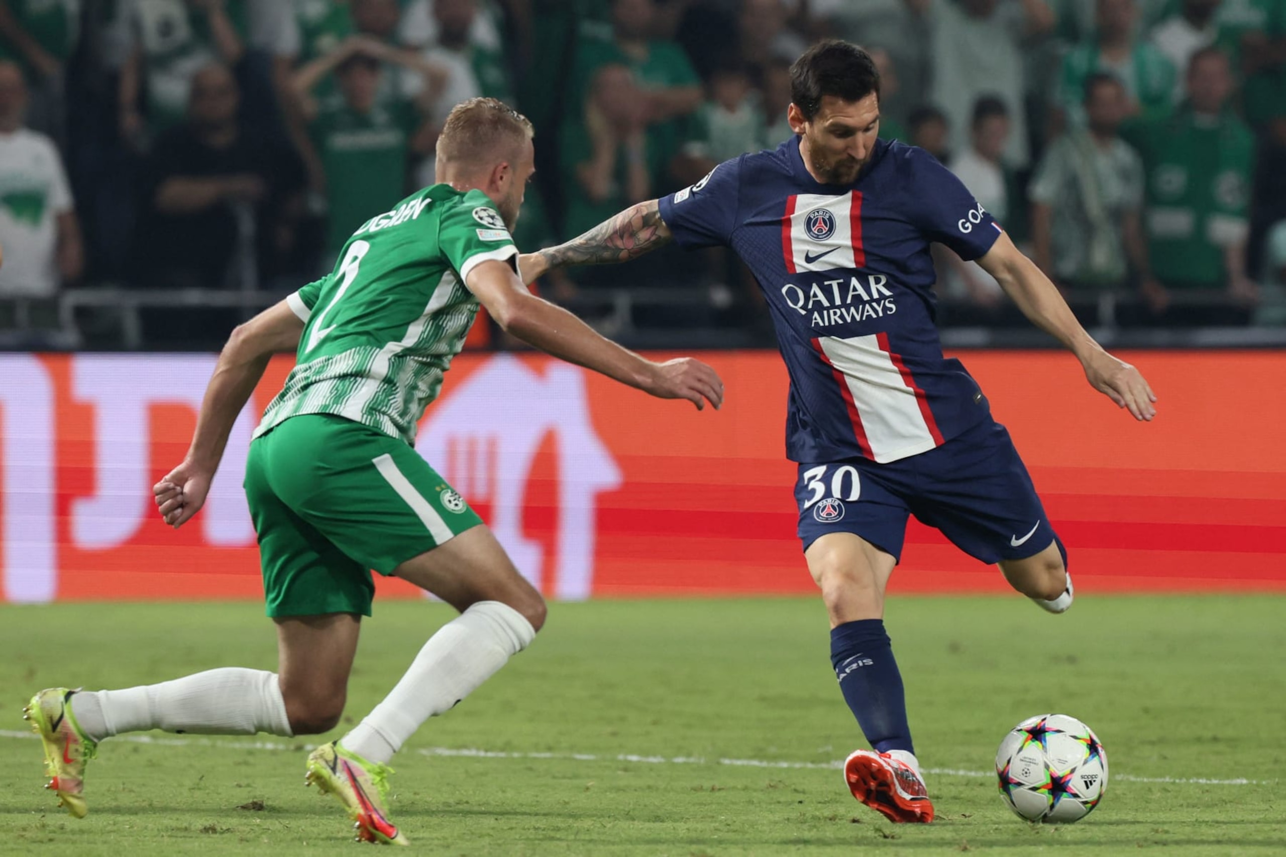 Maccabi Haifa's Swedish defender Daniel Sundgren (L) attempts to block Paris Saint-Germain's Argentine forward Lionel Messi during the UEFA Champions League group H football match between Israel's Maccabi Haifa and France's Paris Saint-Germain (PSG) at the Sammy Ofer stadium in the city of Haifa on September 14, 2022. (Photo by JACK GUEZ / AFP) (Photo by JACK GUEZ/AFP via Getty Images) Maccabi Haifa's Swedish defender Daniel Sundgren (L) attempts to block Paris Saint-Germain's Argentine forward Lionel Messi during the UEFA Champions League group H football match between Israel's Maccabi Haifa and France's Paris Saint-Germain (PSG) at the Sammy Ofer stadium in the city of Haifa on September 14, 2022. (Photo by JACK GUEZ / AFP) (Photo by JACK GUEZ/AFP via Getty Images)