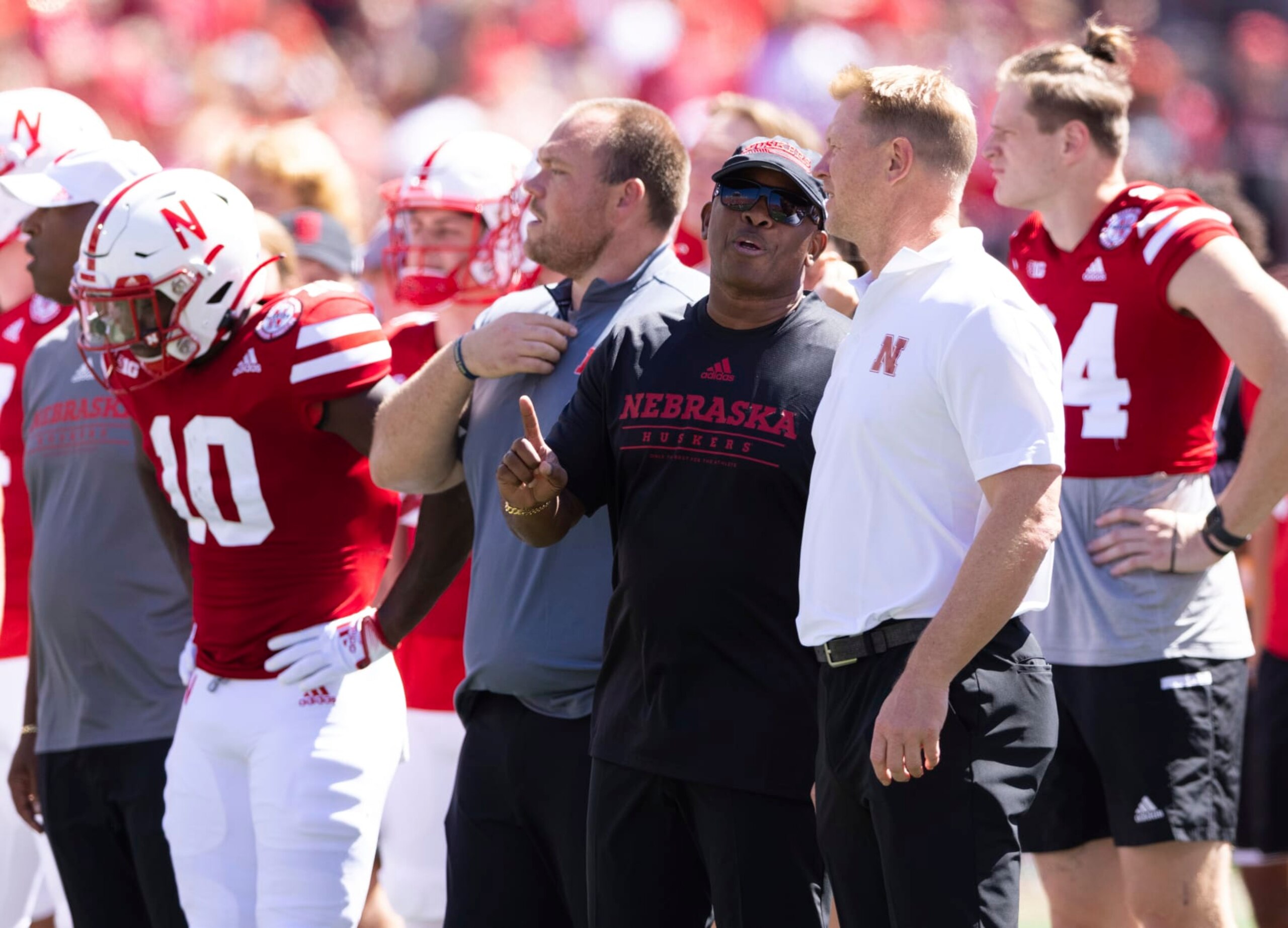 Nebraska associate head coach and wide receivers/passing game coordinator Mickey Joseph, left, chats with head coach Scott Frost before the team plays against North Dakota in an NCAA college football game Saturday, Sept. 3, 2022, in Lincoln, Neb. (AP Photo/Rebecca S. Gratz)