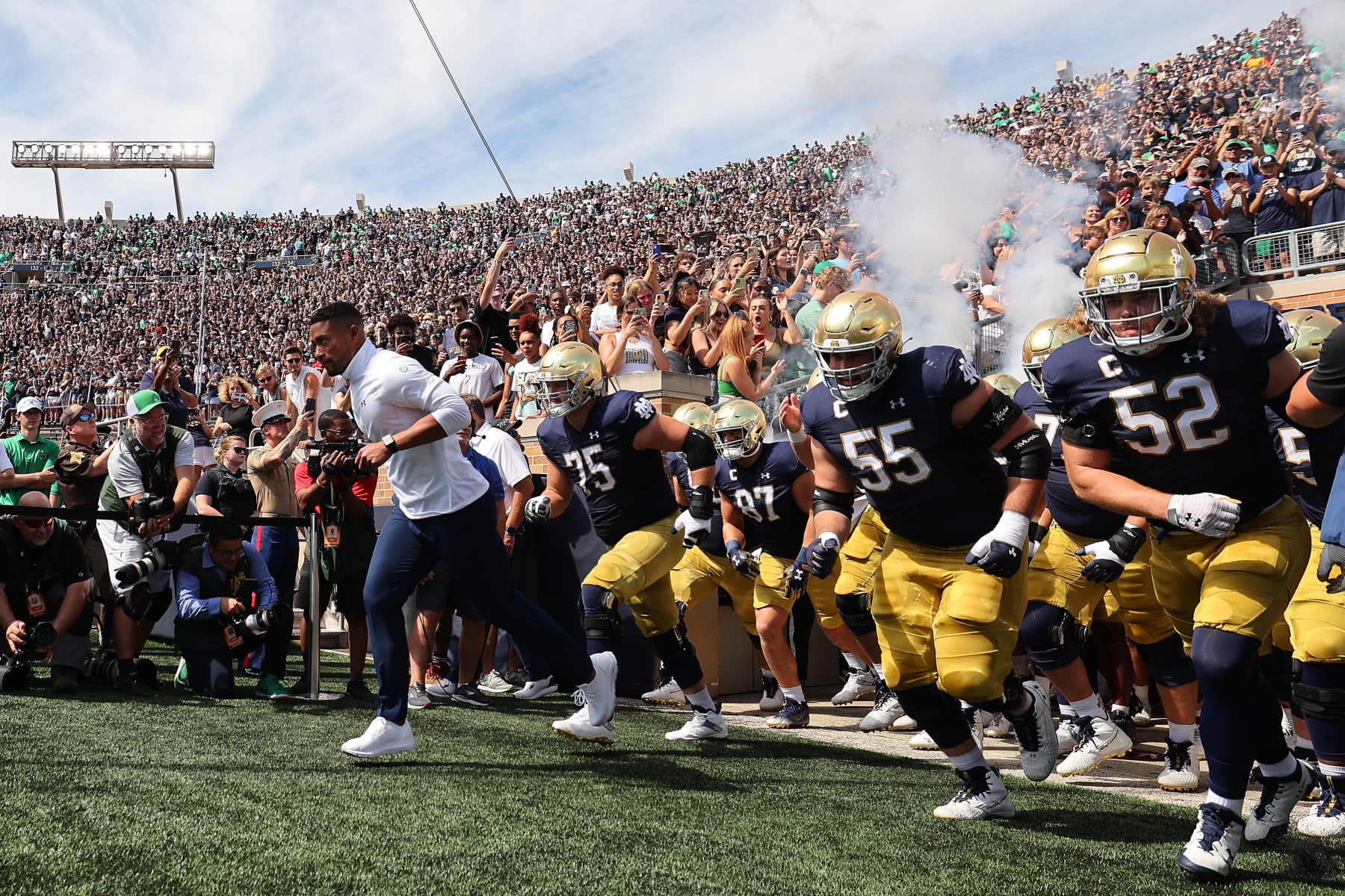 SOUTH BEND, INDIANA - SEPTEMBER 10: Head coach Marcus Freeman of the Notre Dame Fighting Irish takes the field prior to the game against the Marshall Thundering Herd at Notre Dame Stadium on September 10, 2022 in South Bend, Indiana. (Photo by Michael Reaves/Getty Images) SOUTH BEND, INDIANA - SEPTEMBER 10: Head coach Marcus Freeman of the Notre Dame Fighting Irish takes the field prior to the game against the Marshall Thundering Herd at Notre Dame Stadium on September 10, 2022 in South Bend, Indiana. (Photo by Michael Reaves/Getty Images)