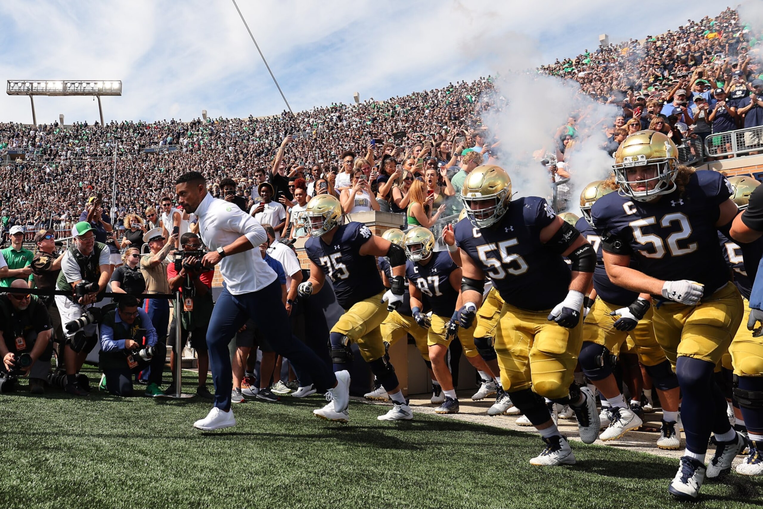 SOUTH BEND, INDIANA - SEPTEMBER 10: Head coach Marcus Freeman of the Notre Dame Fighting Irish takes the field prior to the game against the Marshall Thundering Herd at Notre Dame Stadium on September 10, 2022 in South Bend, Indiana. (Photo by Michael Reaves/Getty Images)