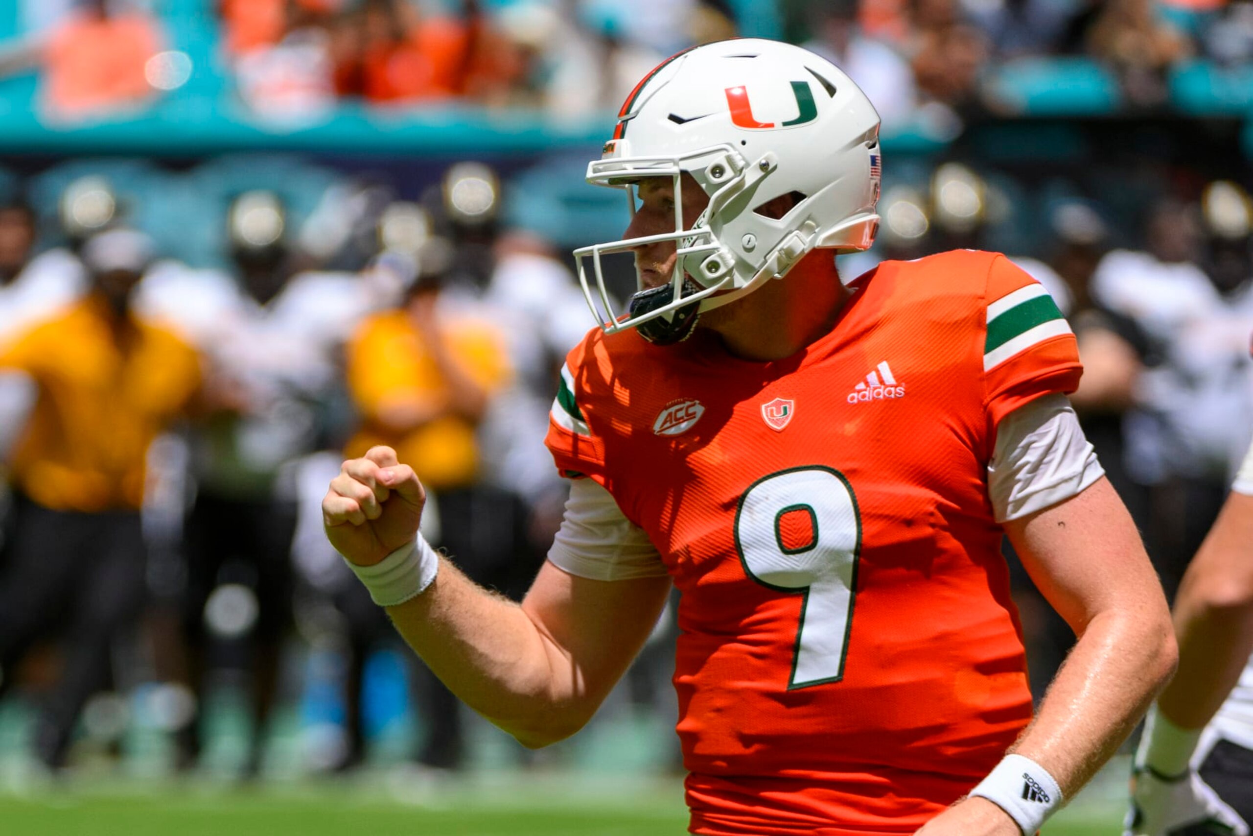 MIAMI GARDENS, FL - SEPTEMBER 10: Miami quarterback Tyler Van Dyke (9) pumps his fist as he celebrates Miami running back Henry Parrish, Jr. (not shown) scoring a touchdown during the college football game between the Southern Miss Golden Eagles and the University of Miami Hurricanes on September 10, 2022 at the Hard Rock Stadium in Miami Gardens, FL. (Photo by Doug Murray/Icon Sportswire via Getty Images)