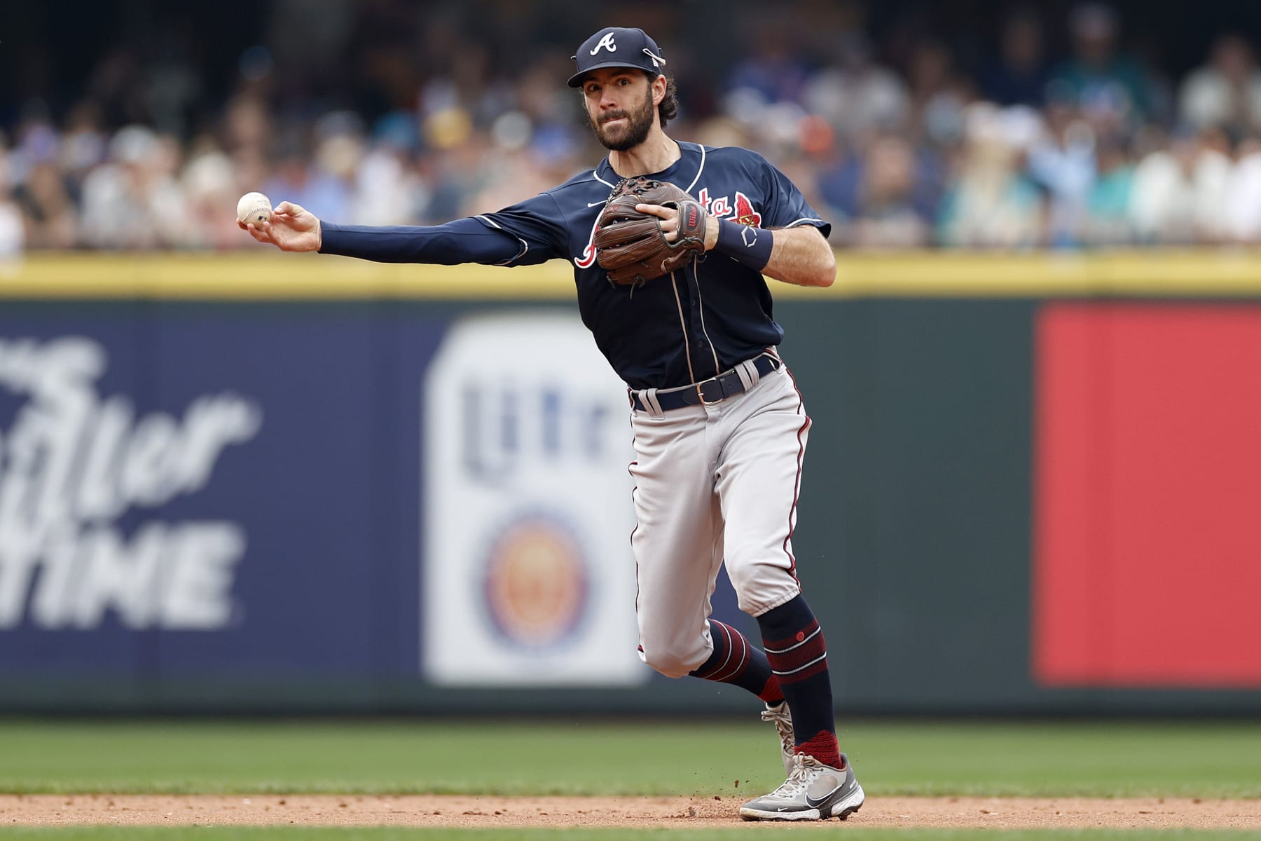 SEATTLE, WASHINGTON - SEPTEMBER 11: Dansby Swanson #7 of the Atlanta Braves throws to first base during the sixth inning against the Seattle Mariners at T-Mobile Park on September 11, 2022 in Seattle, Washington. (Photo by Steph Chambers/Getty Images)