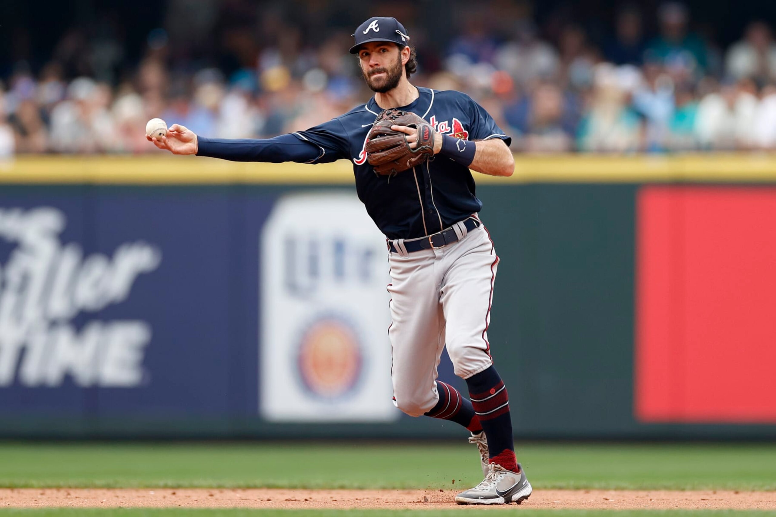 SEATTLE, WASHINGTON - SEPTEMBER 11: Dansby Swanson #7 of the Atlanta Braves throws to first base during the sixth inning against the Seattle Mariners at T-Mobile Park on September 11, 2022 in Seattle, Washington. (Photo by Steph Chambers/Getty Images)