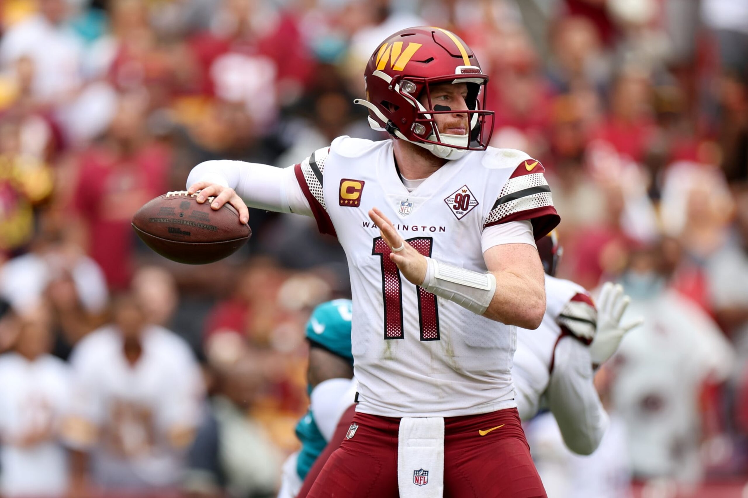 LANDOVER, MARYLAND - SEPTEMBER 11: Quarterback Carson Wentz #11 of the Washington Commanders passes against the Jacksonville Jaguars at FedExField on September 11, 2022 in Landover, Maryland. (Photo by Rob Carr/Getty Images)