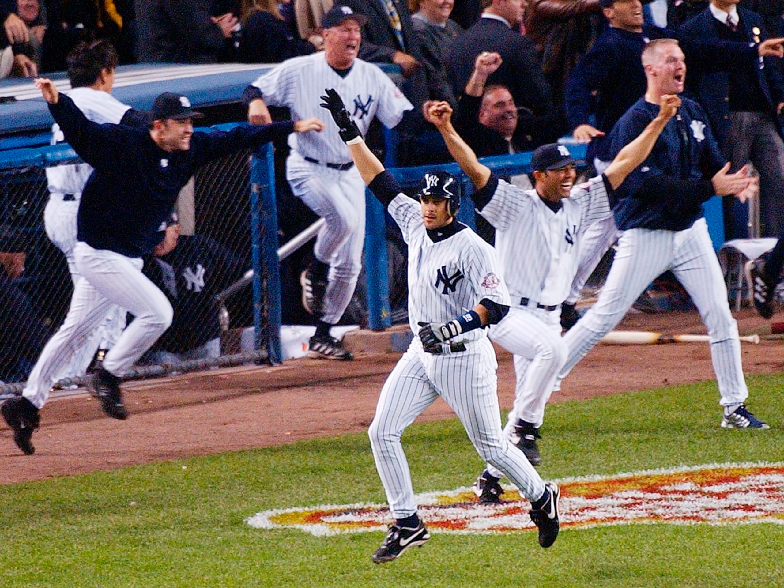 FILE - In this Oct. 16, 2003, file photo, New York Yankees' Aaron Boone, center, celebrates after hitting a solo home run in the 11th inning to beat the Boston Red Sox in Game 7 of the American League Championship Series in New York. Boone became the first person with no experience as a manager of coach to interview to become Joe Girardi's successor with the New York Yankees. The 44-year-old interviewed Friday, Nov. 17, 2017, becoming the fourth to go through the process after Yankees bench coach Rob Thomson, former Cleveland and Seattle manager Eric Wedge, and San Francisco bench coach Hensley Meulens. (AP Photo/Bill Kostroun, File) FILE - In this Oct. 16, 2003, file photo, New York Yankees' Aaron Boone, center, celebrates after hitting a solo home run in the 11th inning to beat the Boston Red Sox in Game 7 of the American League Championship Series in New York. Boone became the first person with no experience as a manager of coach to interview to become Joe Girardi's successor with the New York Yankees. The 44-year-old interviewed Friday, Nov. 17, 2017, becoming the fourth to go through the process after Yankees bench coach Rob Thomson, former Cleveland and Seattle manager Eric Wedge, and San Francisco bench coach Hensley Meulens. (AP Photo/Bill Kostroun, File)