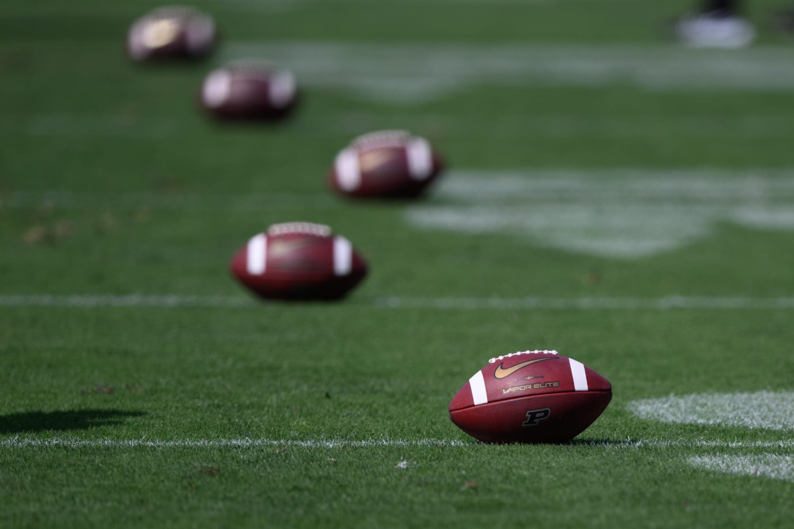 WEST LAFAYETTE, IN - SEPTEMBER 10: College footballs sit on the field before the college football game between the Purdue Boilermakers and Indiana State Sycamores on September 10, 2022, at Ross-Ade Stadium in West Lafayette, IN. (Photo by Zach Bolinger/Icon Sportswire via Getty Images)