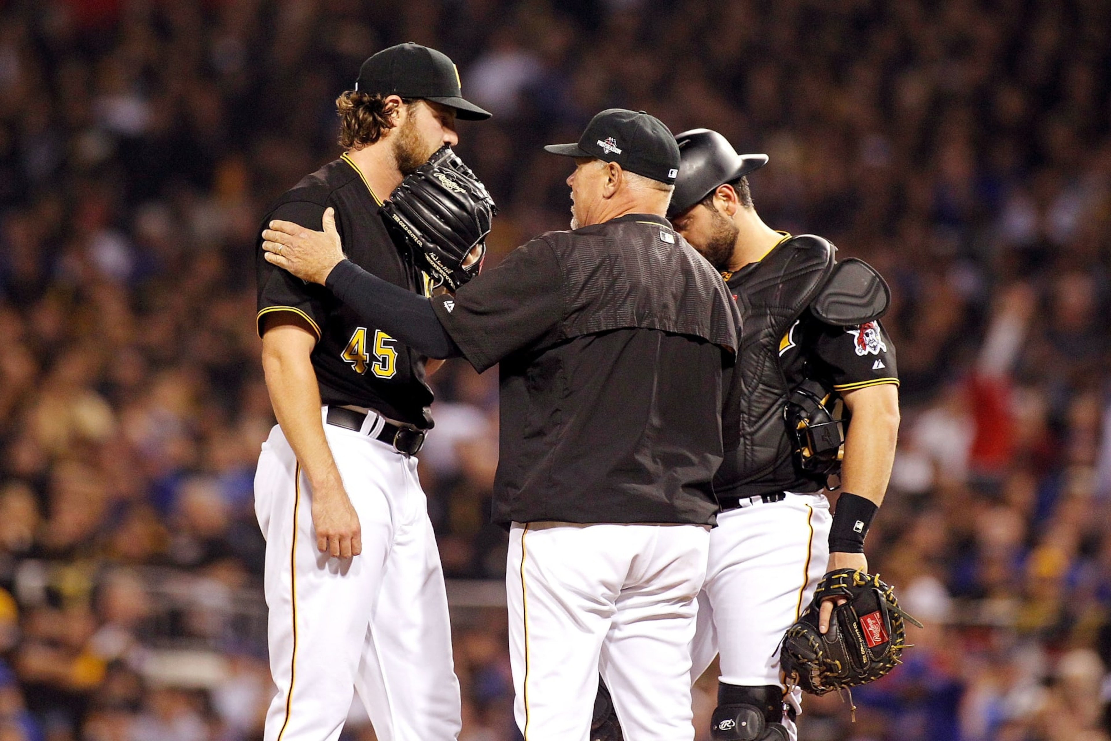 PITTSBURGH, PA - OCTOBER 07:  Ray Searage #54 of the Pittsburgh Pirates talks with Gerrit Cole #45 of the Pittsburgh Pirates and Francisco Cervelli #29 of the Pittsburgh Pirates on the pitcher's mound in the third inning during the National League Wild Card game against the Chicago Cubs at PNC Park on October 7, 2015 in Pittsburgh, Pennsylvania.  (Photo by Justin K. Aller/Getty Images)