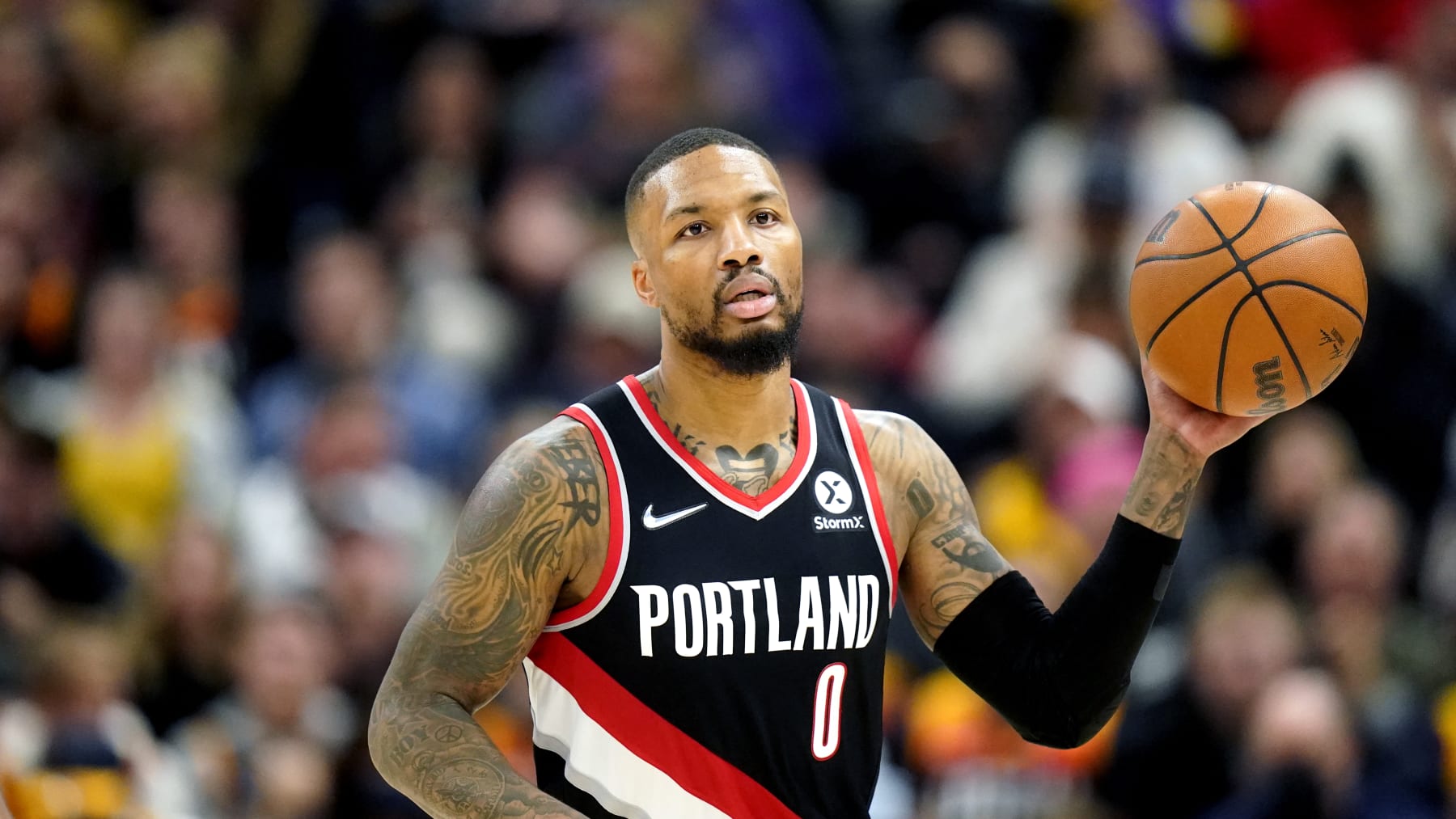 Portland Trail Blazers guard Damian Lillard (0) brings the ball up court in the first half during an NBA basketball game against the Utah Jazz Monday, Nov. 29, 2021, in Salt Lake City. (AP Photo/Rick Bowmer)