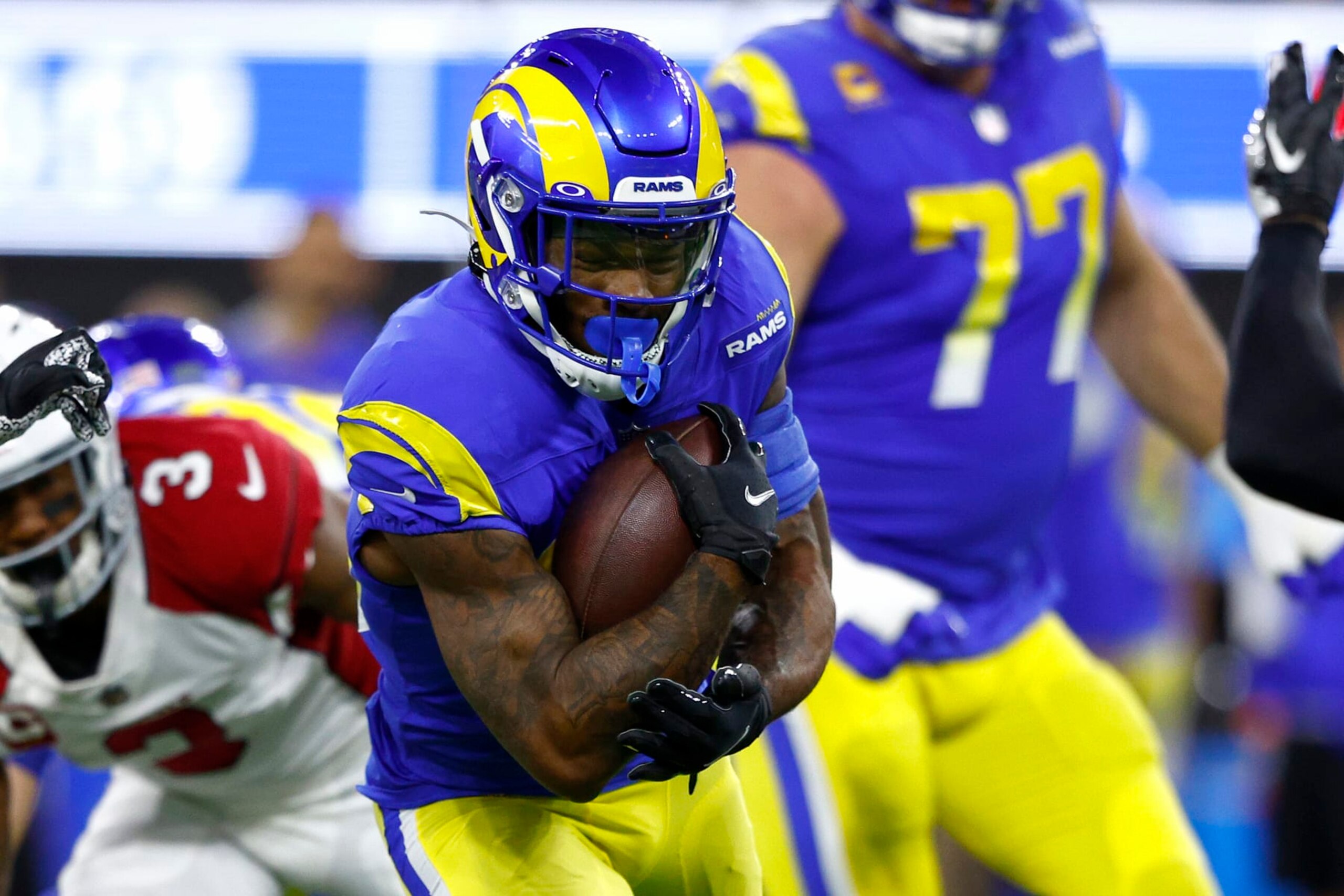 INGLEWOOD, CALIFORNIA - JANUARY 17: Cam Akers #23 of the Los Angeles Rams runs with the ball in the first quarter of the game against the Arizona Cardinals in the NFC Wild Card Playoff game at SoFi Stadium on January 17, 2022 in Inglewood, California. (Photo by Ronald Martinez/Getty Images)