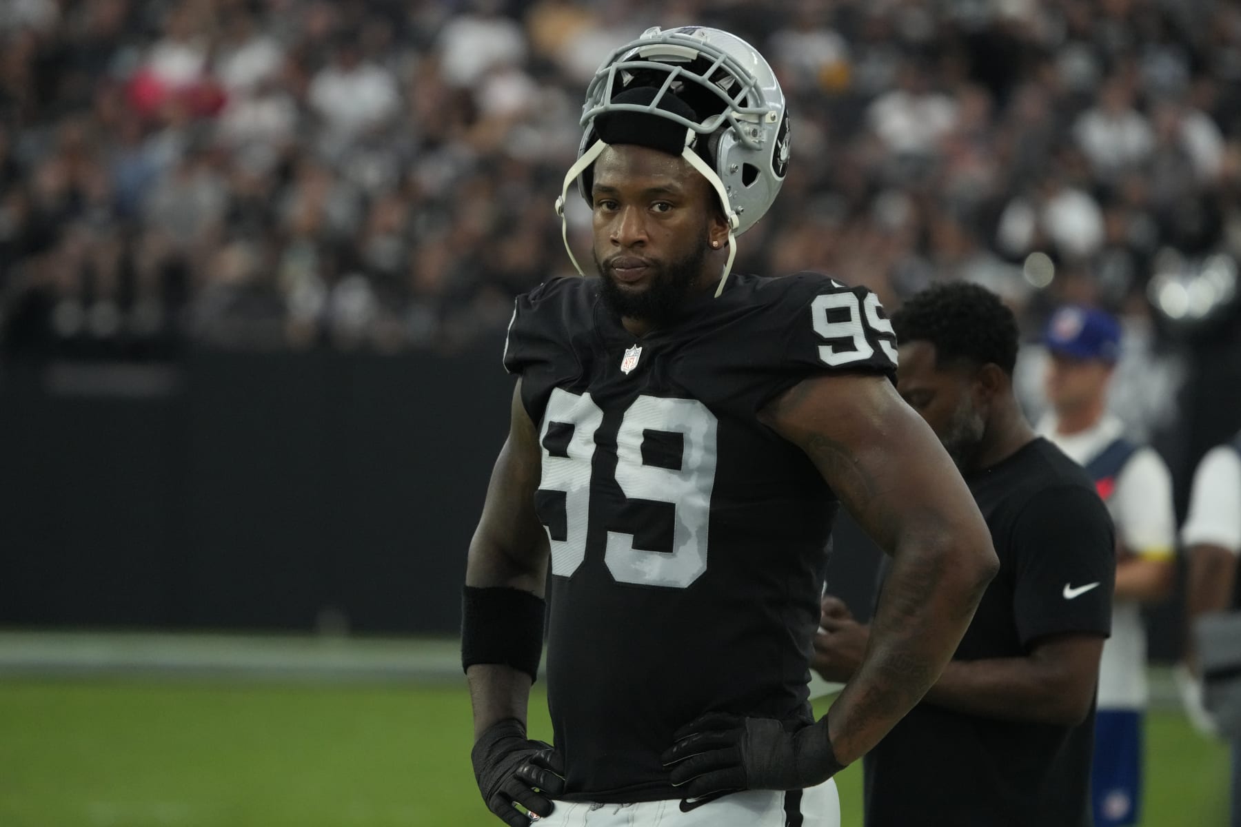 Las Vegas Raiders defensive end Clelin Ferrell (99) watches action against the New England Patriots during the first half of an NFL preseason football game, Friday, Aug. 26, 2022, in Las Vegas. (AP Photo/Rick Scuteri)