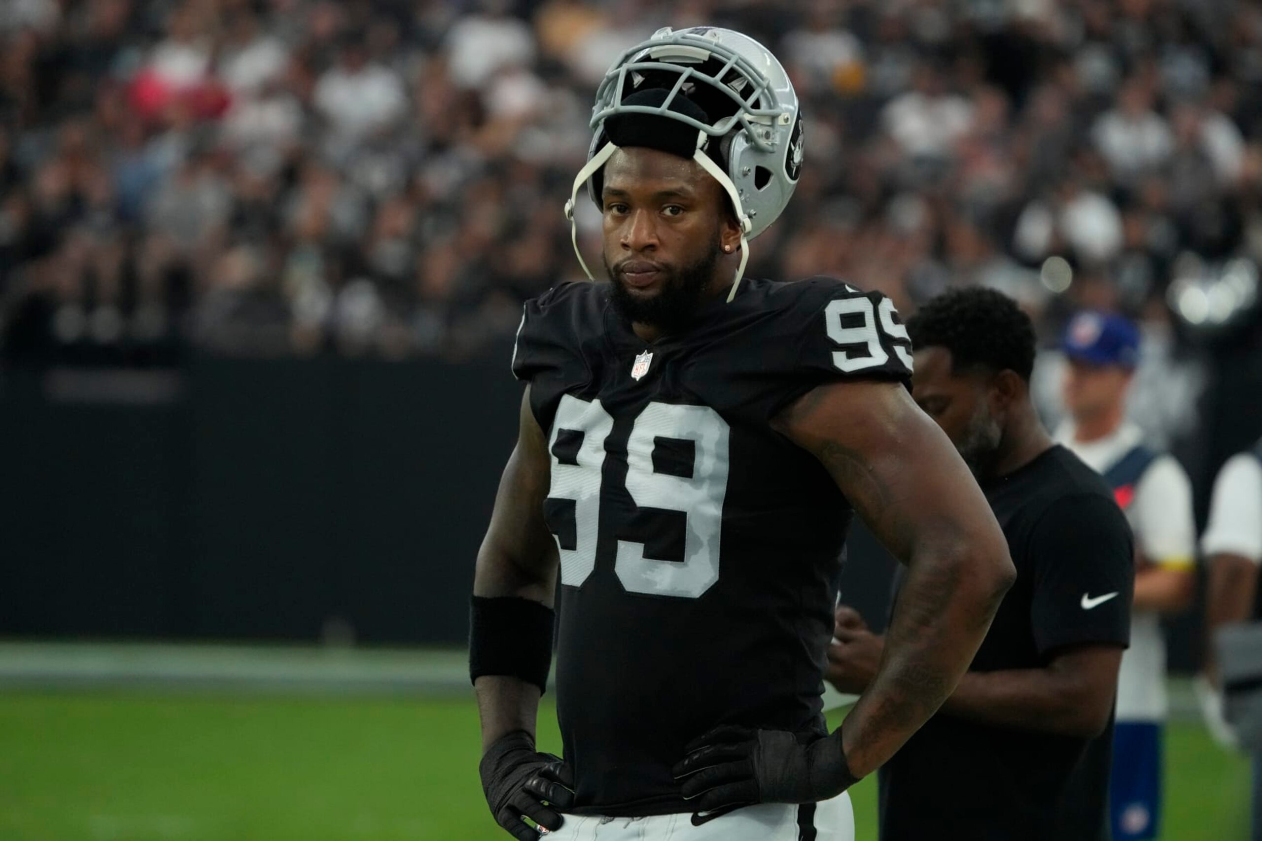 Las Vegas Raiders defensive end Clelin Ferrell (99) watches action against the New England Patriots during the first half of an NFL preseason football game, Friday, Aug. 26, 2022, in Las Vegas. (AP Photo/Rick Scuteri)
