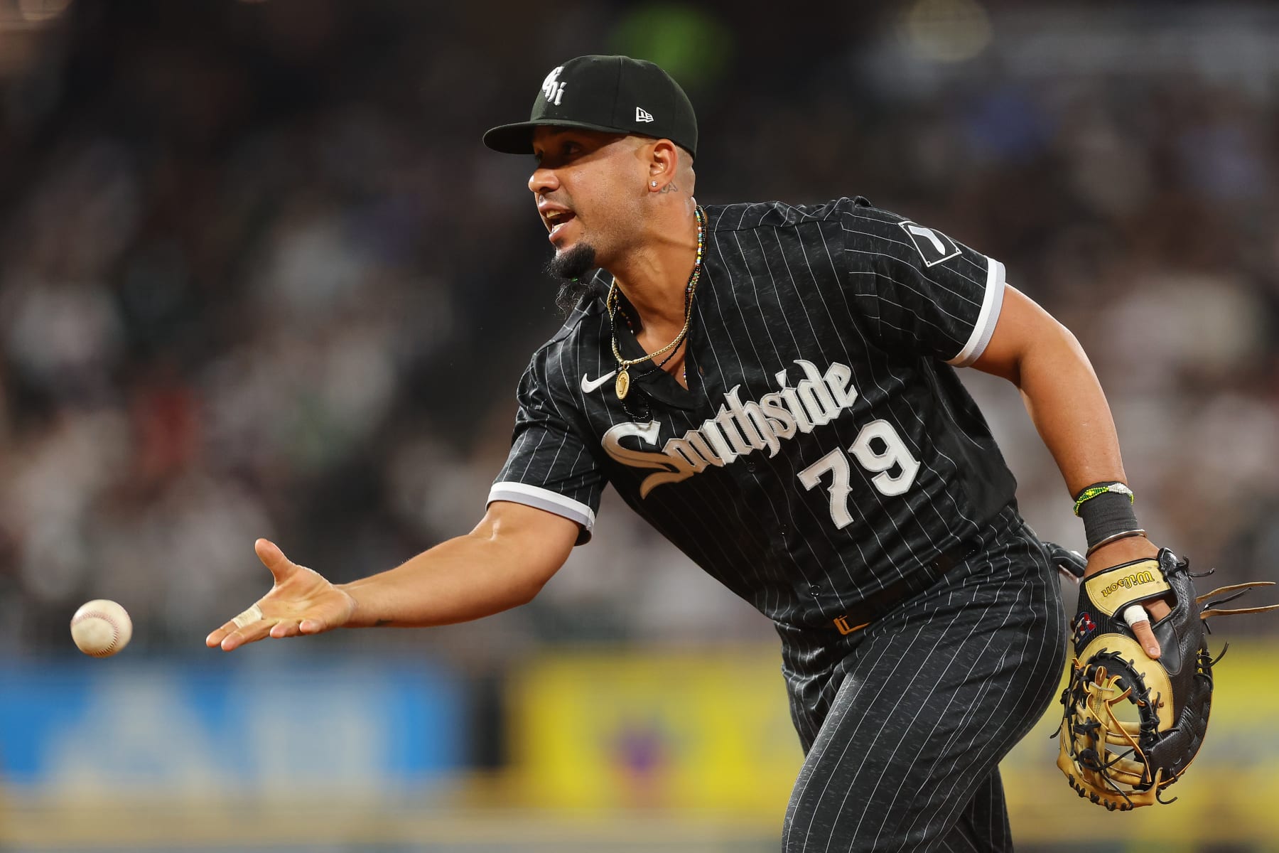 CHICAGO, ILLINOIS - AUGUST 16: Jose Abreu #79 of the Chicago White Sox throws out a runner at first base against the Houston Astros during the sixth inning at Guaranteed Rate Field on August 16, 2022 in Chicago, Illinois. (Photo by Michael Reaves/Getty Images)