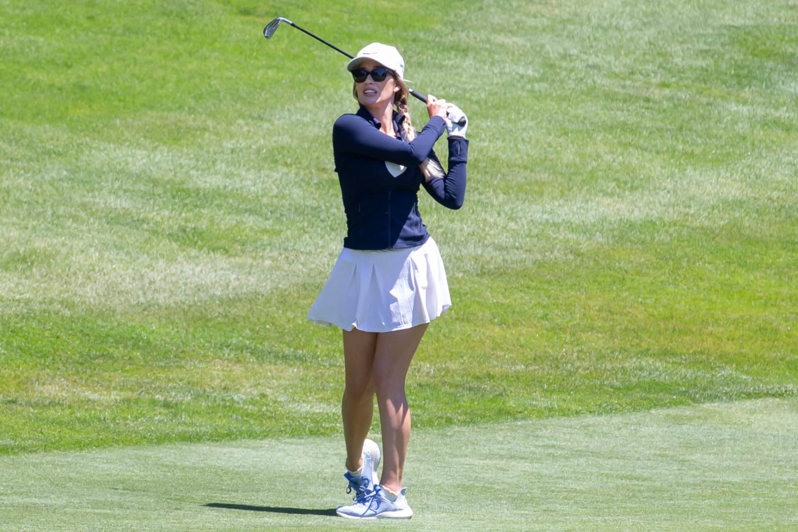 Paige Spiranac watches her approach shot on the 16th hole during the first round of the American Century Celebrity Championship golf tournament at Edgewood Tahoe Golf Course in Stateline, Nev., Friday, July 8, 2022. (AP Photo/Tom R. Smedes)