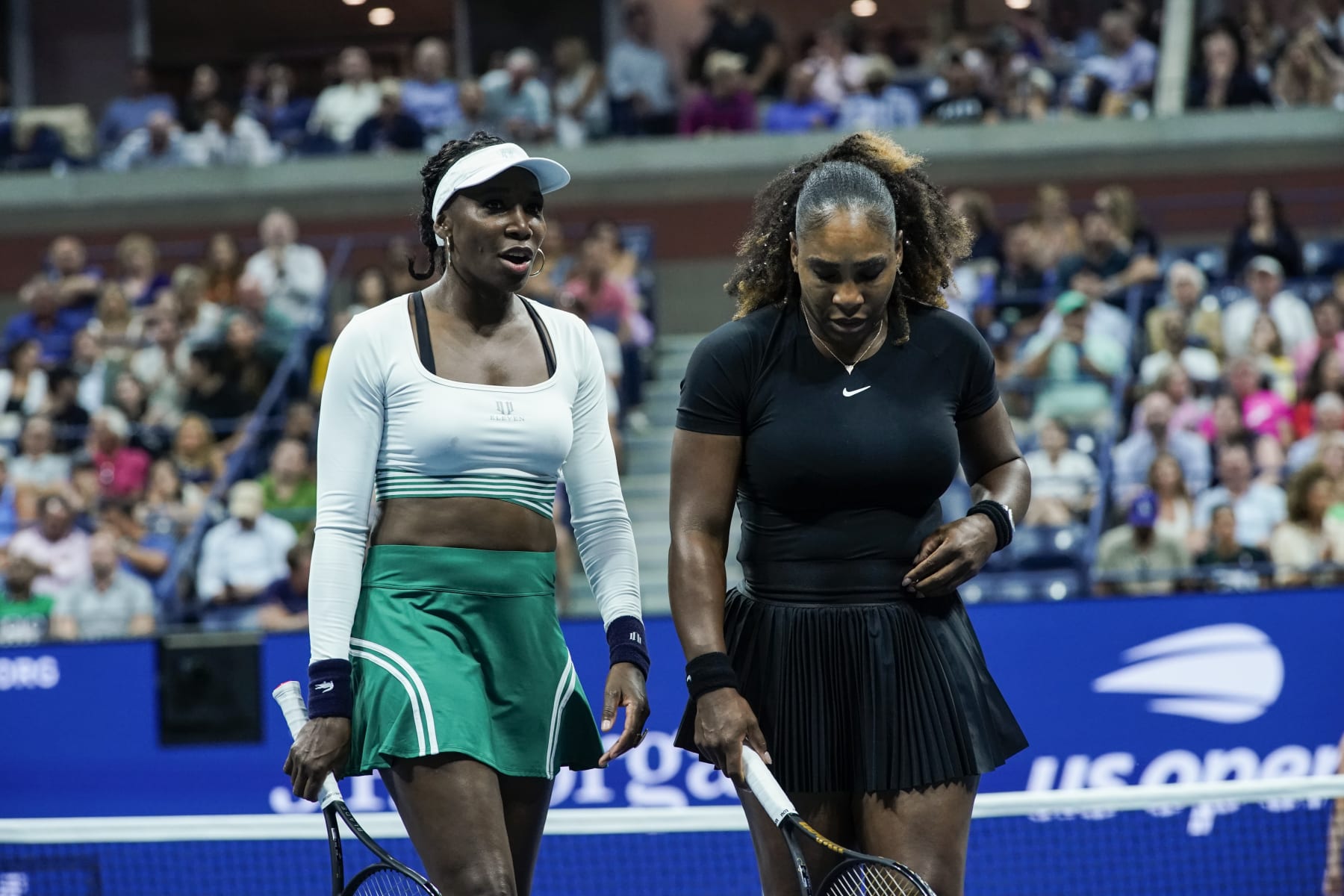 NEW YORK - NEW YORK - SEPTEMBER 1: Serena Williams and Venus Williams of the United States talk on court after losing a point during their Women's Doubles First Round against Linda Noskova and Lucie Hradecka of the Czech Republic on the 2022 U.S. Open Tennis Tournament on September 1, 2022. In New York. (Photo by Eduardo MunozAlvarez/VIEWpress)