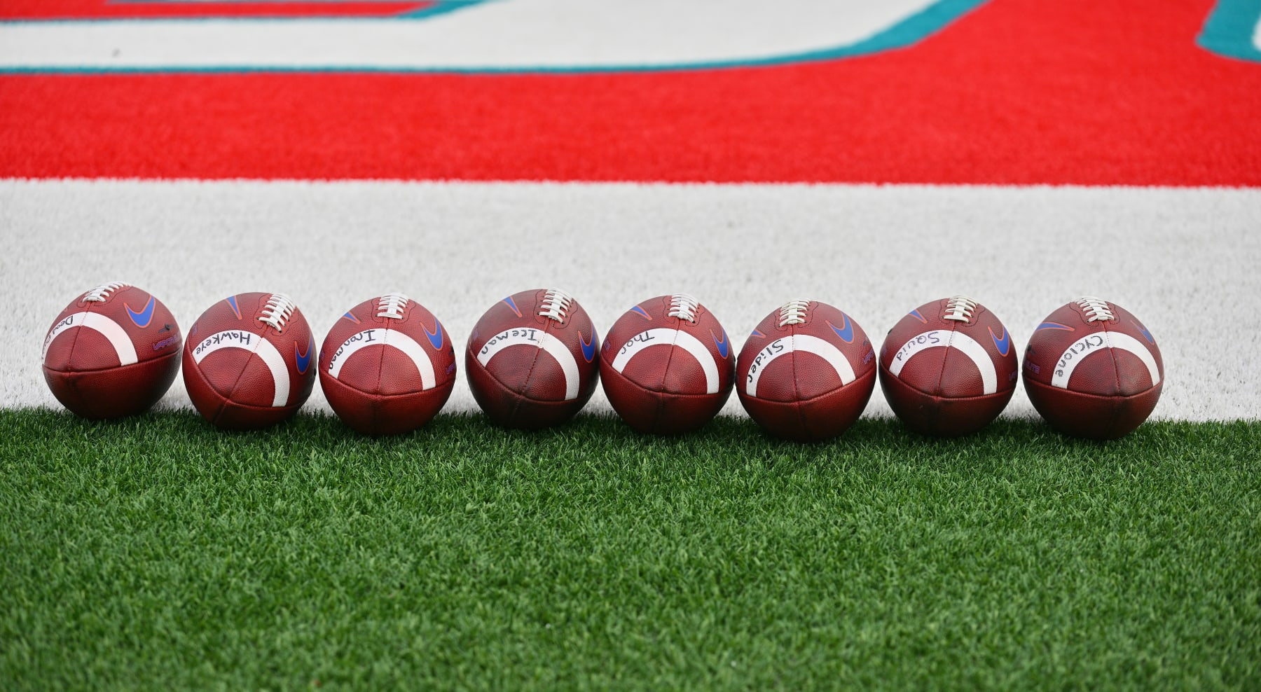 ALBUQUERQUE, NEW MEXICO - SEPTEMBER 09:  Nike footballs are lined up on the field before a game between the Boise State Broncos and the New Mexico Lobos at University Stadium on September 09, 2022 in Albuquerque, New Mexico.  (Photo by Sam Wasson/Getty Images)