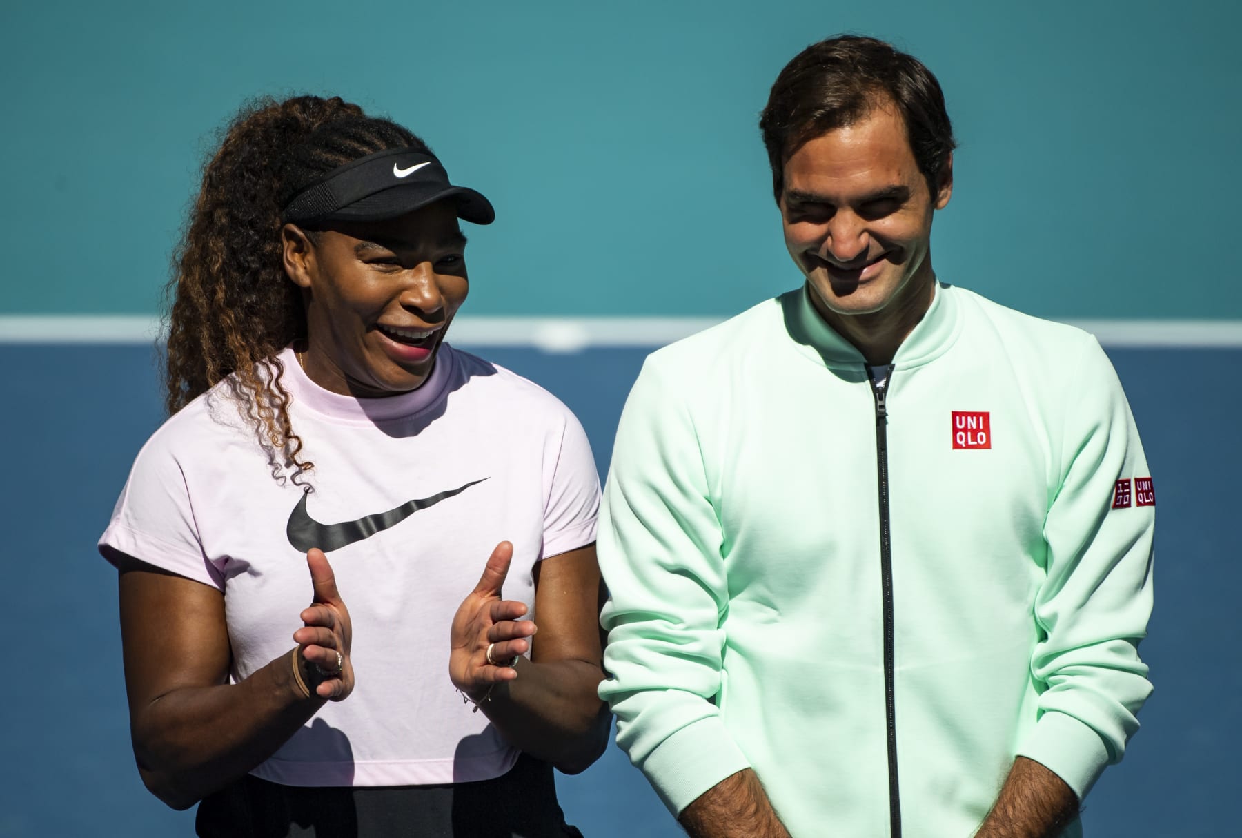 MIAMI GARDENS, FLORIDA - MARCH 20: (L-R) Serena Williams of the United States speaks to Roger Federer of Switzerland during the ribbon cutting ceremony on the new Stadium Court at the Hard Rock Stadium, before the first match of the Miami Open on March 20, 2019 in Miami Gardens, Florida. (Photo by TPN/Getty Images)
