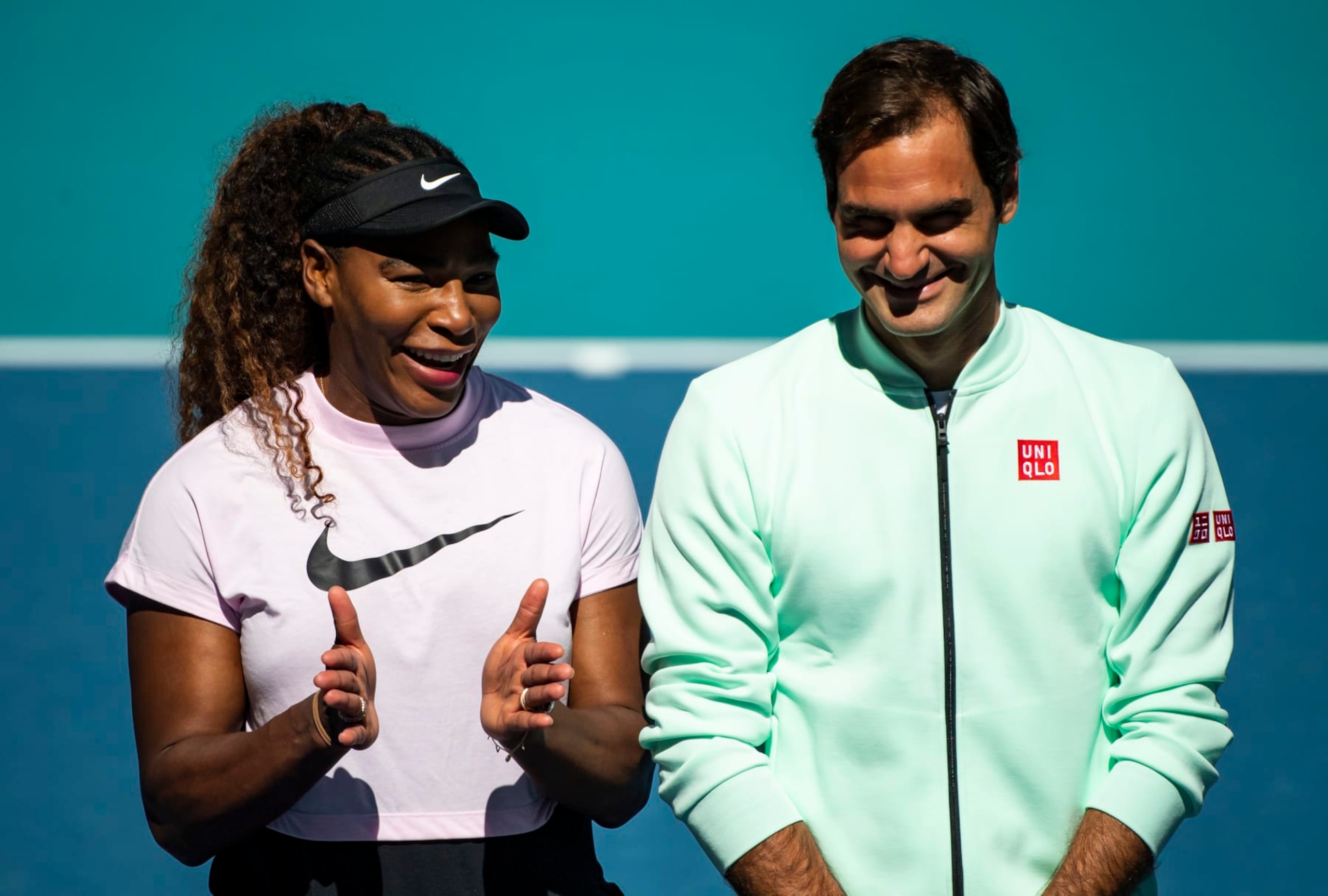 MIAMI GARDENS, FLORIDA - MARCH 20: (L-R) Serena Williams of the United States speaks to Roger Federer of Switzerland during the ribbon cutting ceremony on the new Stadium Court at the Hard Rock Stadium, before the first match of the Miami Open on March 20, 2019 in Miami Gardens, Florida. (Photo by TPN/Getty Images)