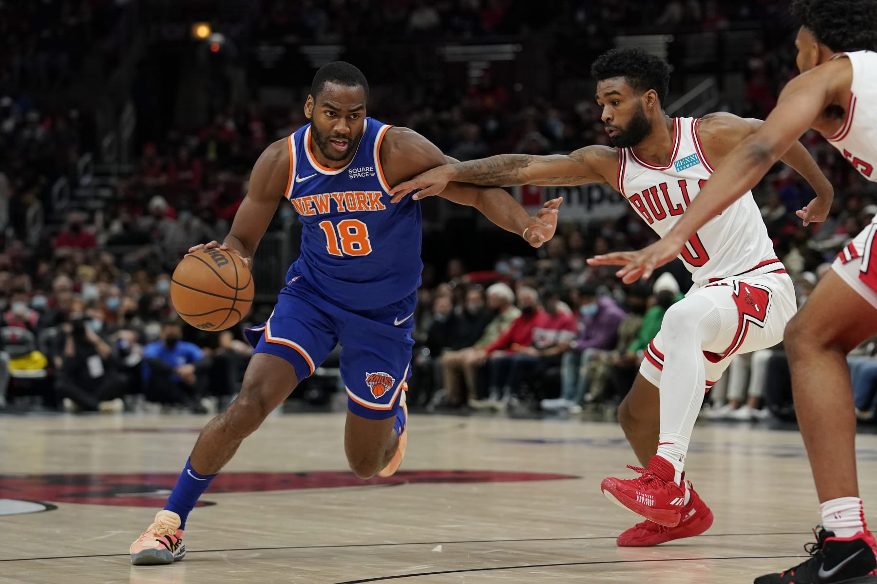 CHICAGO, ILLINOIS - NOVEMBER 21: Alec Burks #18 of the New York Knicks dribbles the ball against Coby White #0 of the Chicago Bulls in the first half at United Center on November 21, 2021 in Chicago, Illinois. NOTE TO USER: User expressly acknowledges and agrees that, by downloading and or using this photograph, user is consenting to the terms and conditions of the Getty Images License Agreement. (Photo by Patrick McDermott/Getty Images)