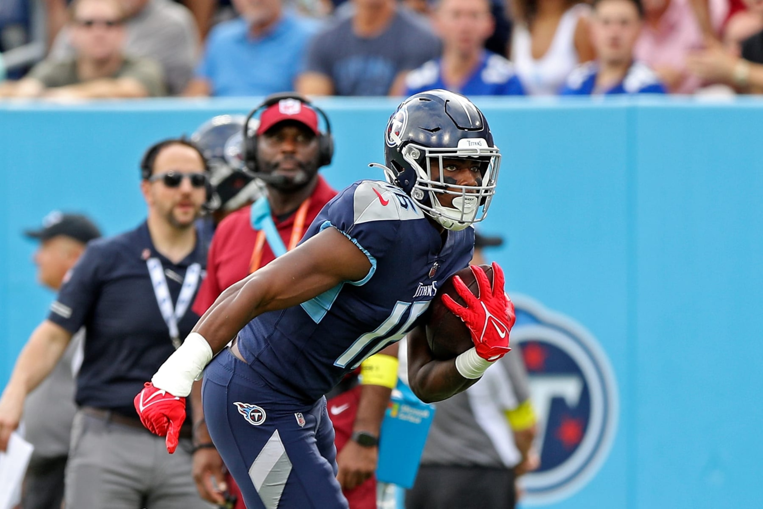 NASHVILLE, TENNESSEE - SEPTEMBER 11: Treylon Burks #16 of the Tennessee Titans carries the ball during the game against the New York Giants at Nissan Stadium on September 11, 2022 in Nashville, Tennessee. (Photo by Justin Ford/Getty Images)