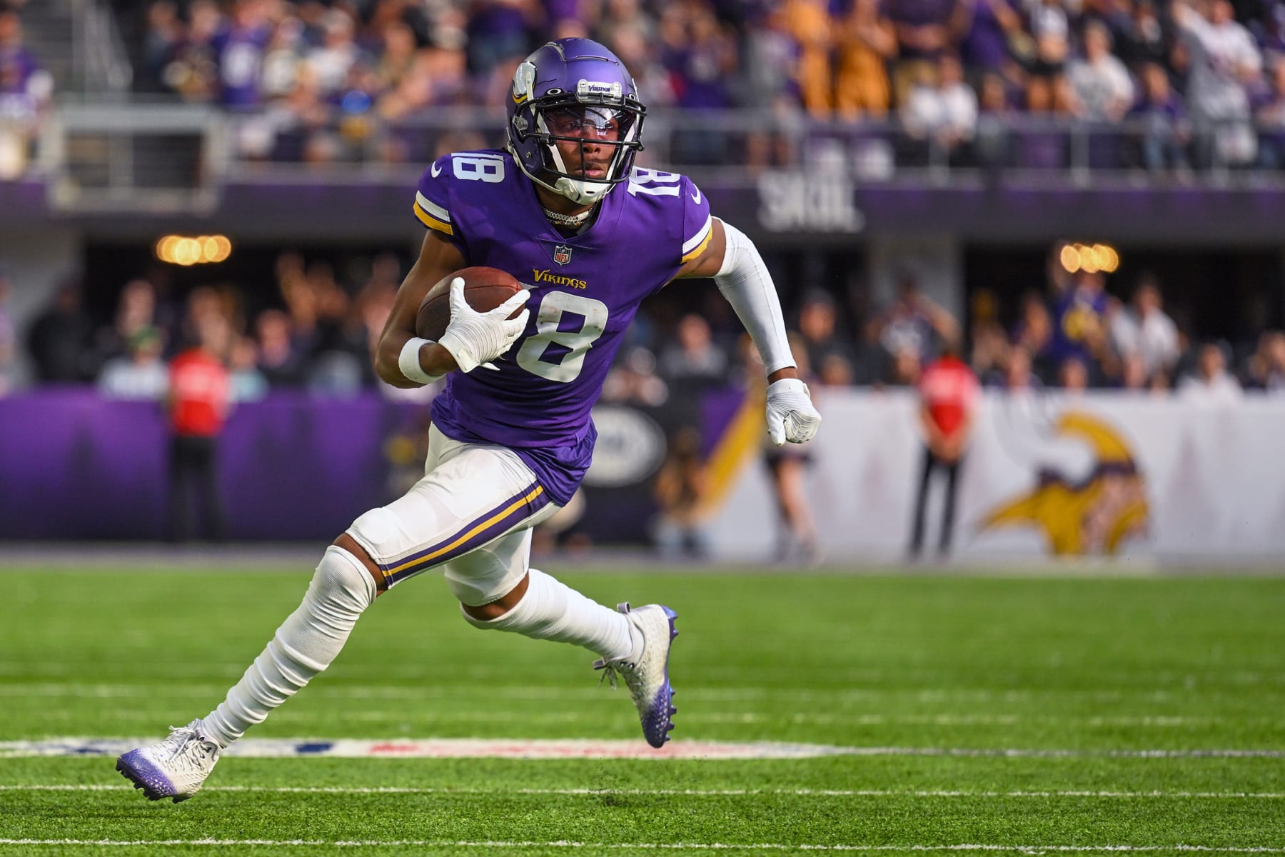 MINNEAPOLIS, MN - SEPTEMBER 11: Minnesota Vikings wide receiver Justin Jefferson (18) runs to the end zone for a 36-yard touchdown reception during the second quarter of an NFL game between the Minnesota Vikings and Green Bay Packers on September 11, 2022 at U.S. Bank Stadium in Minneapolis, MN.(Photo by Nick Wosika/Icon Sportswire via Getty Images)