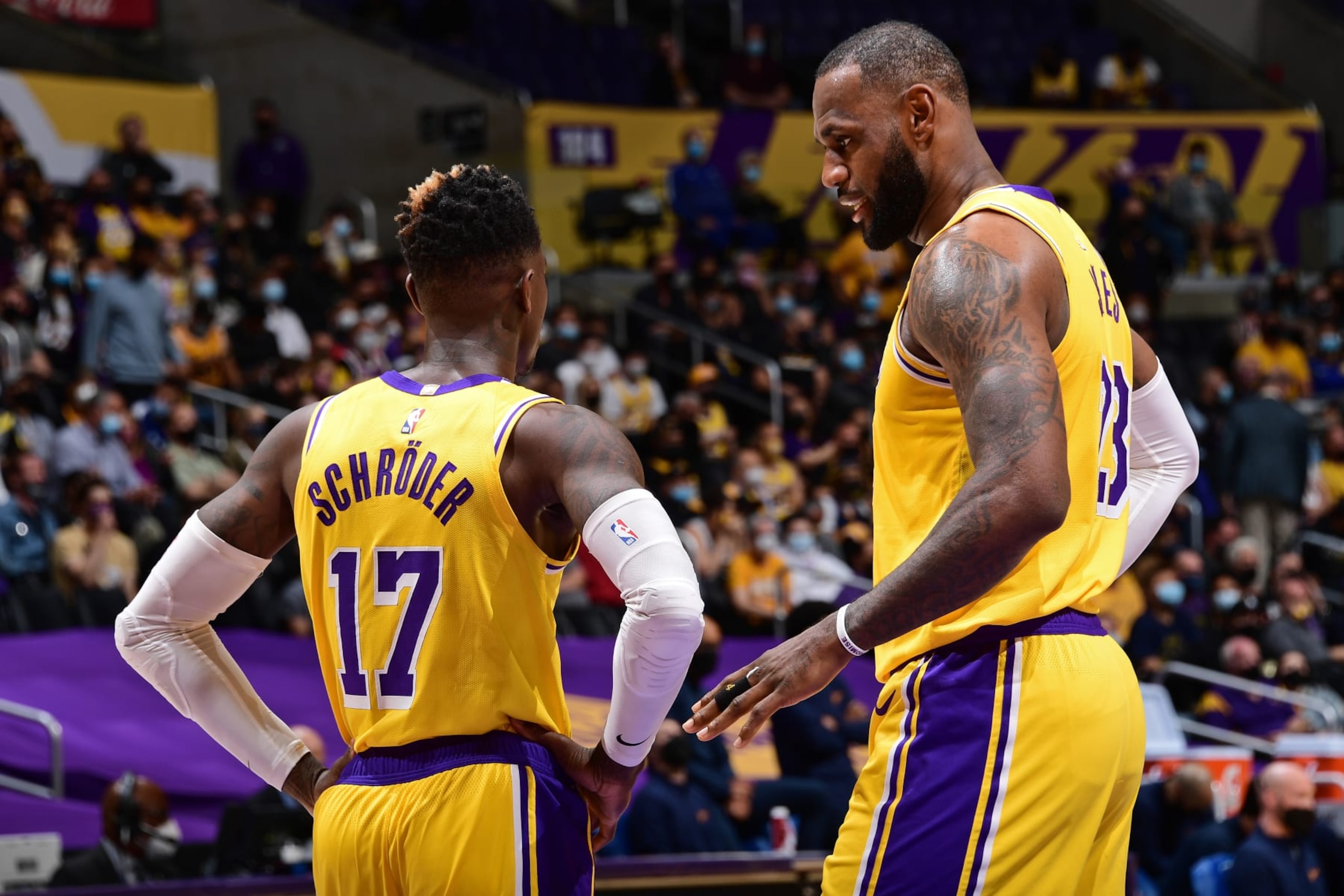 LOS ANGELES, CA - MAY 19: Dennis Schroder #17 and LeBron James #23 of the Los Angeles Lakers talk during the 2021 NBA Play-In Tournament on May 19, 2021 at STAPLES Center in Los Angeles, California. NOTE TO USER: User expressly acknowledges and agrees that, by downloading and/or using this Photograph, user is consenting to the terms and conditions of the Getty Images License Agreement. Mandatory Copyright Notice: Copyright 2021 NBAE (Photo by Adam Pantozzi/NBAE via Getty Images)