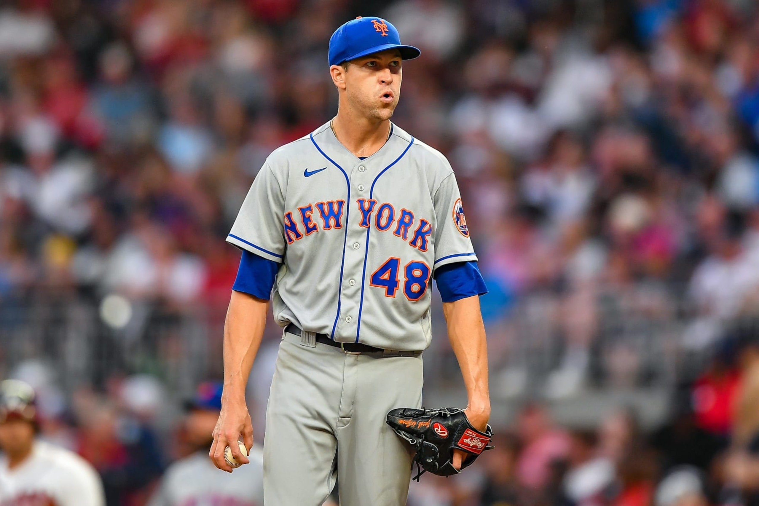 ATLANTA, GA August 18: New York starting pitcher Jacob deGrom (48) reacts after giving up two runs in the third inning during the MLB game between the New York Mets and the Atlanta Braves on August 18th, 2022 at Truist Park in Atlanta, GA. (Photo by Rich von Biberstein/Icon Sportswire via Getty Images) ATLANTA, GA August 18: New York starting pitcher Jacob deGrom (48) reacts after giving up two runs in the third inning during the MLB game between the New York Mets and the Atlanta Braves on August 18th, 2022 at Truist Park in Atlanta, GA. (Photo by Rich von Biberstein/Icon Sportswire via Getty Images)